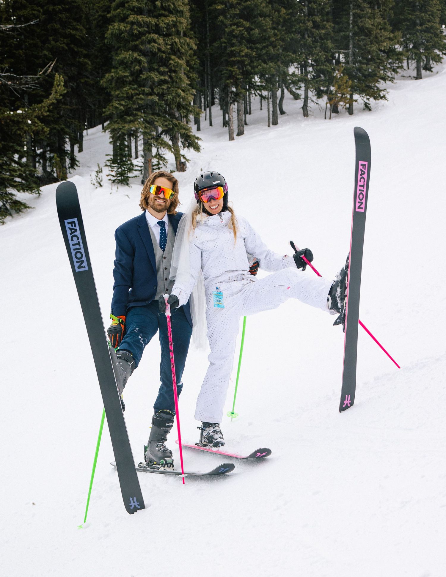 Couple skiing together during winter engagement session.