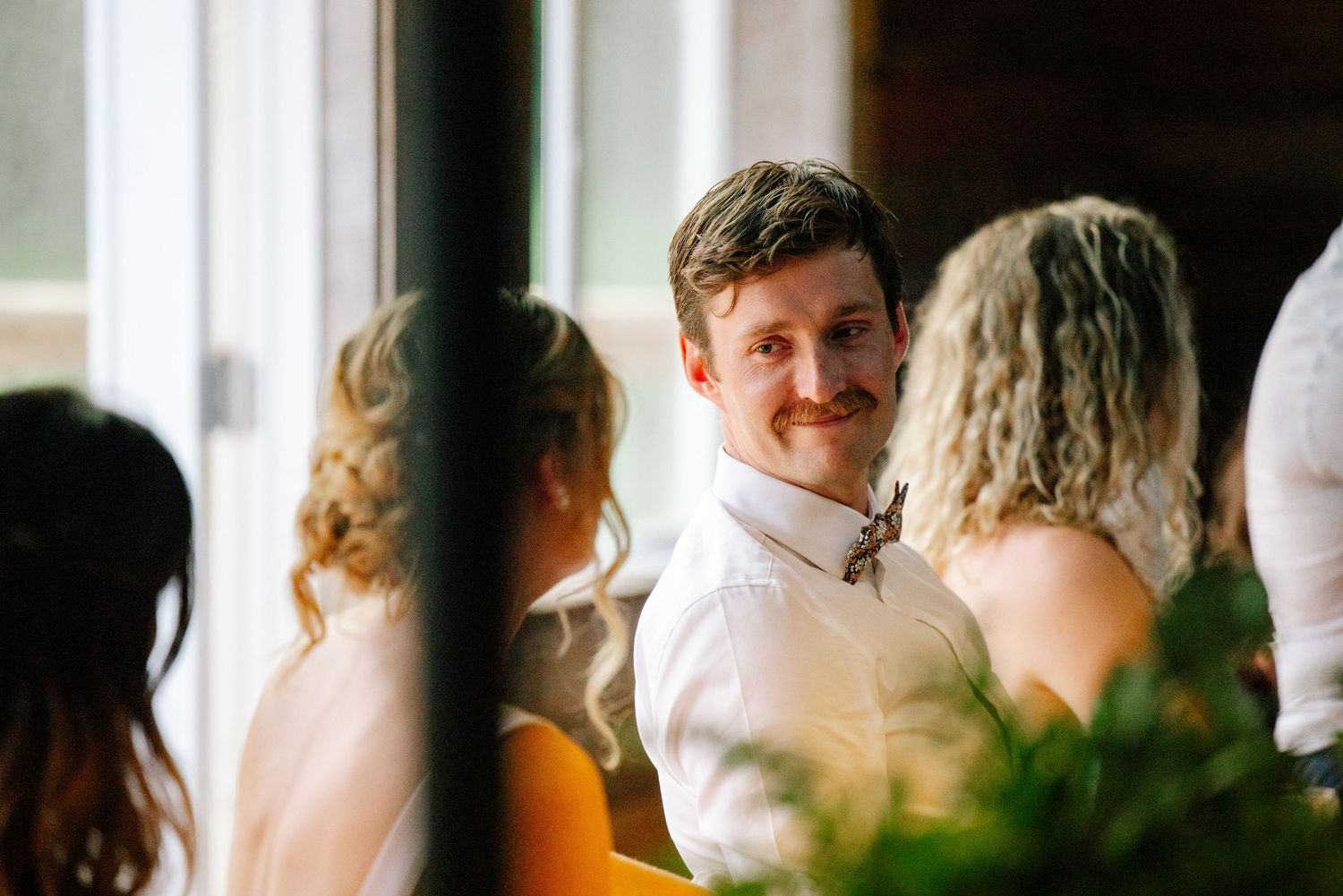 Groom looking at bride lovingly.