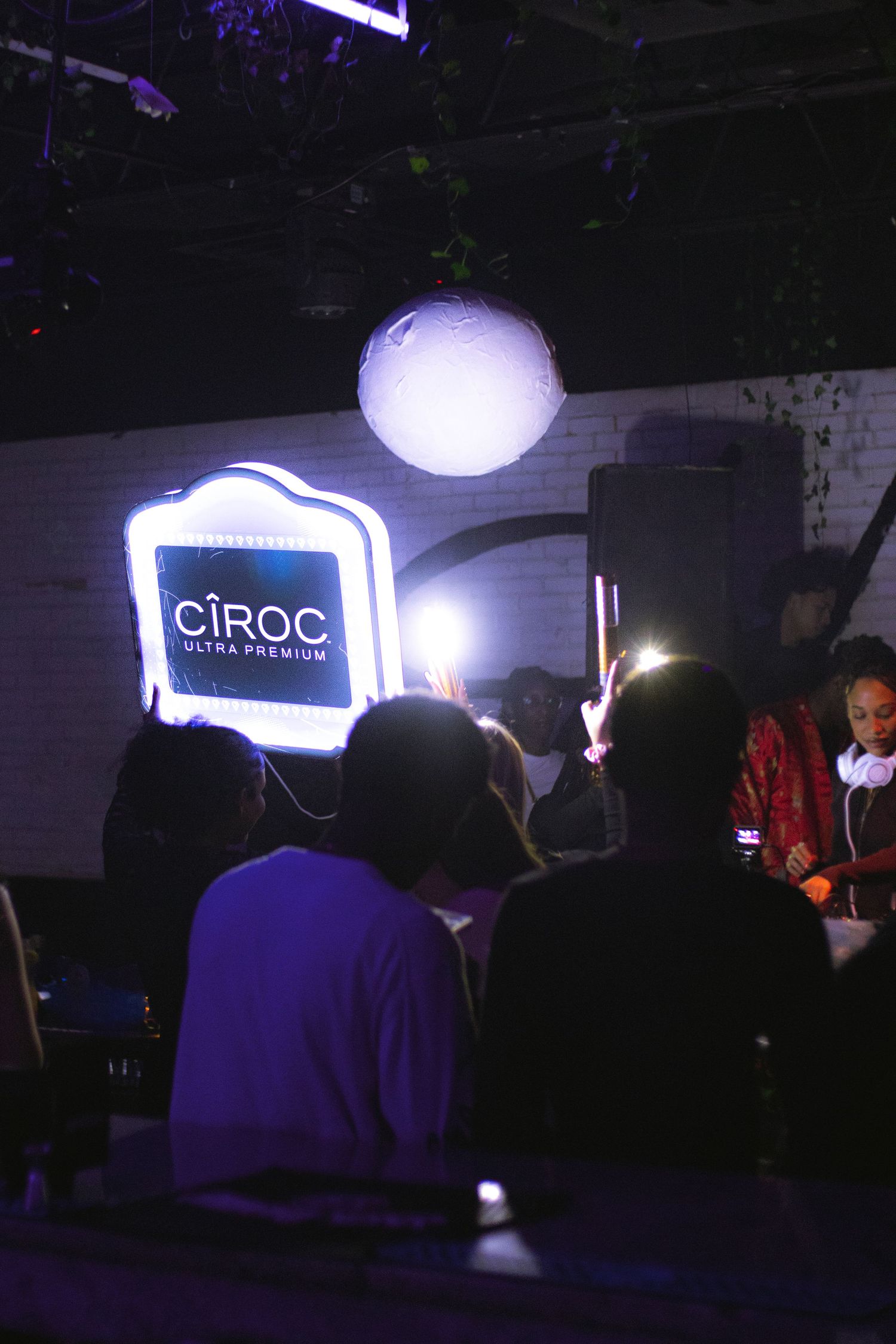 Ciroc vodka logo illuminated in blue light at nightclub event.