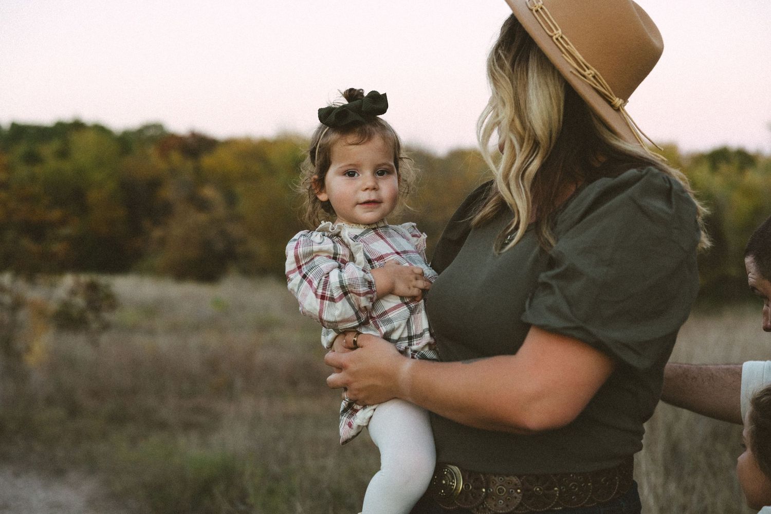 Golden hour motherhood moment during photography session at Arbor Hills in Plano, Texas.