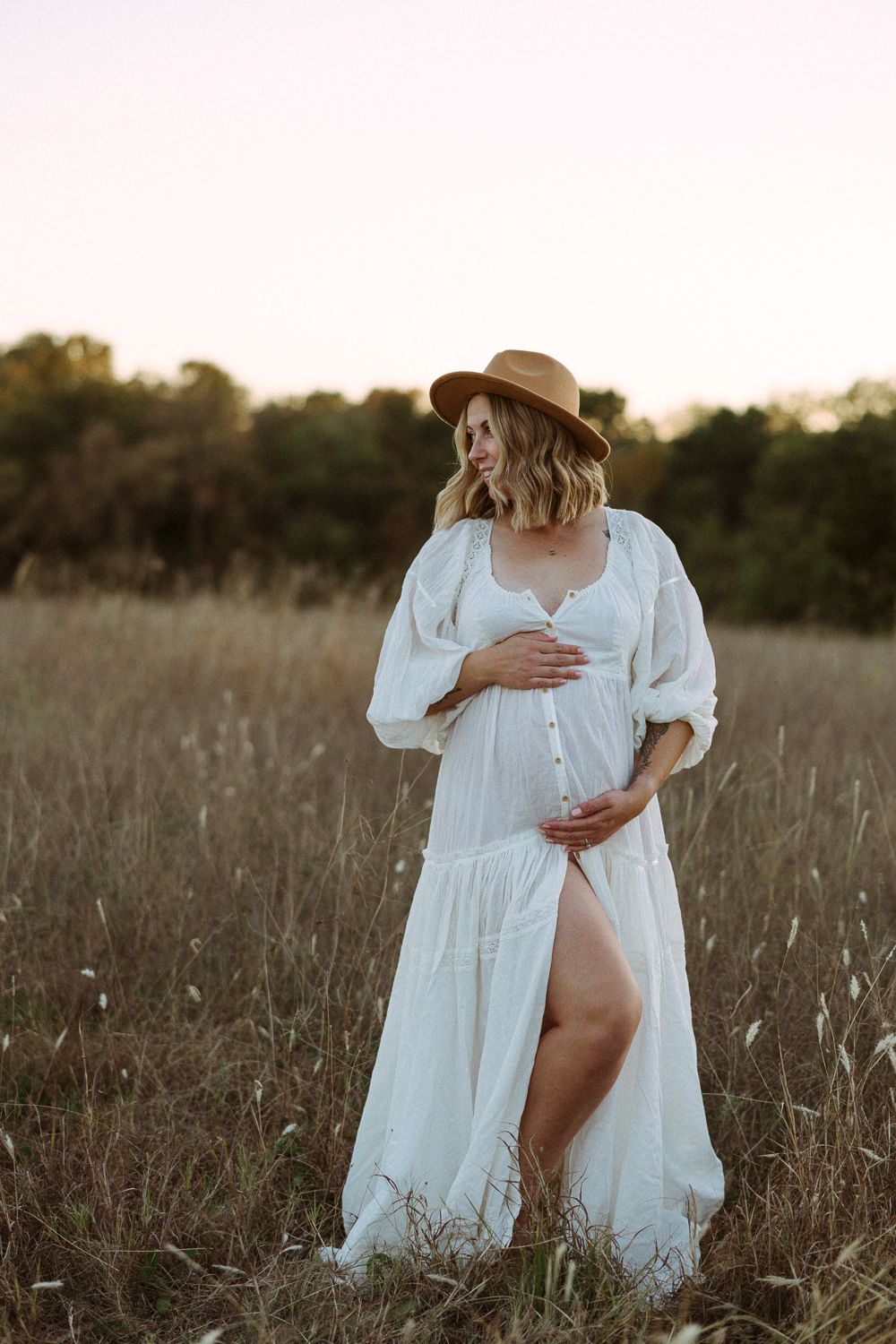 Glowing maternity moment for this beautiful mom to be during her maternity photography session in Erwin Park, Dallas.