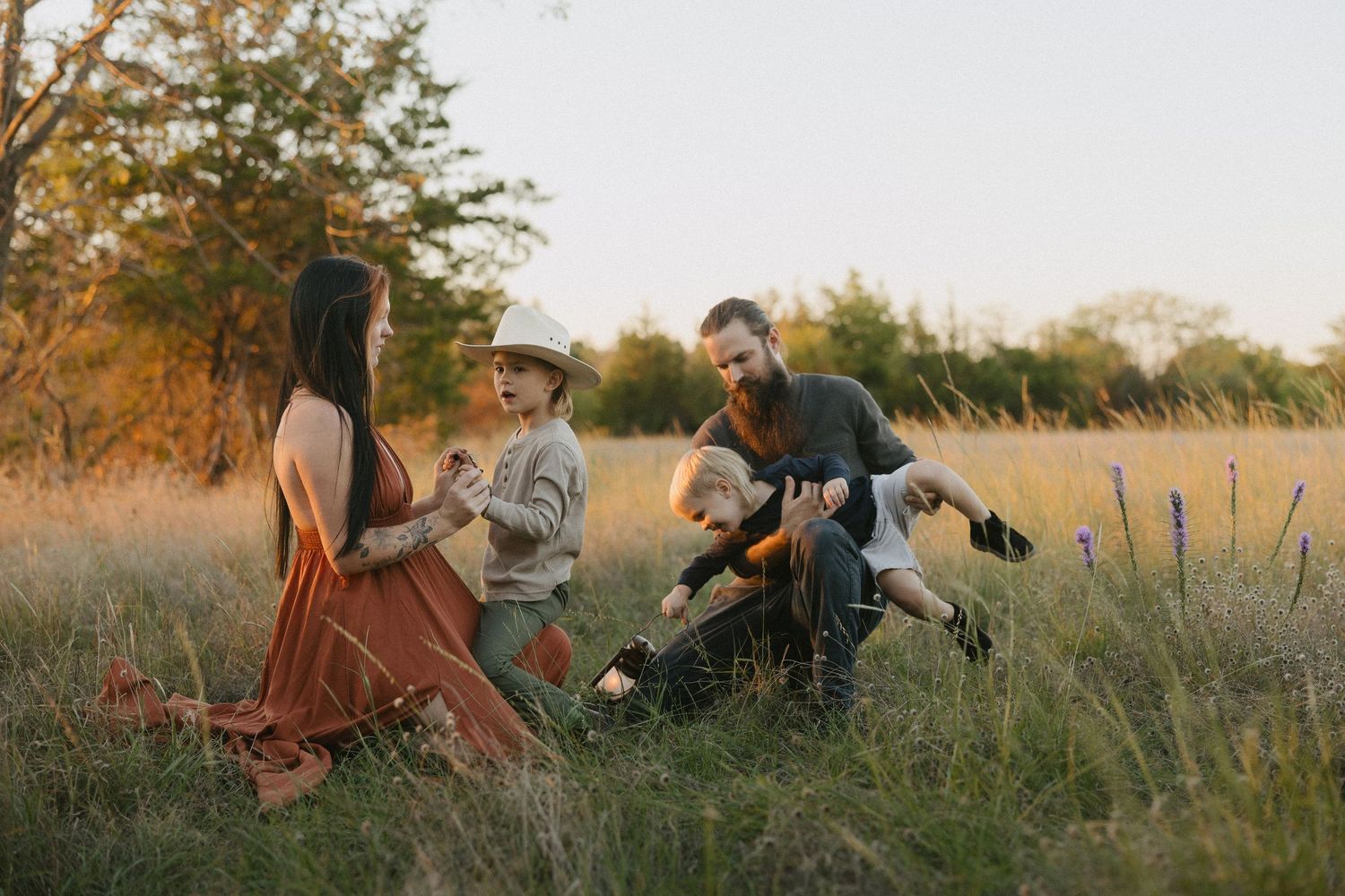 A storytelling moment between a family of four during their family photos in Fort Worth, Texas