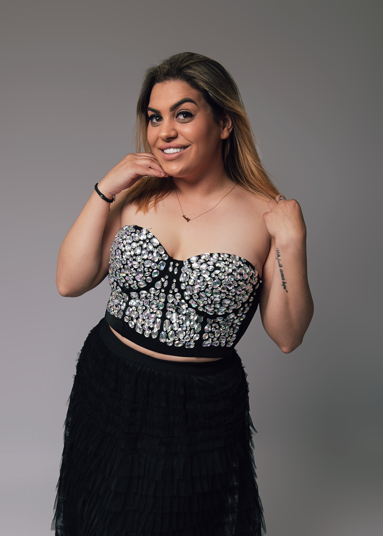 Studio portrait of confident woman in black dress – Spalding photographer