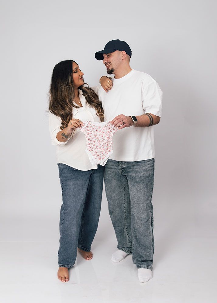 Maternity photography with partner Stamford - loving couple expecting baby captured in artistic studio session
