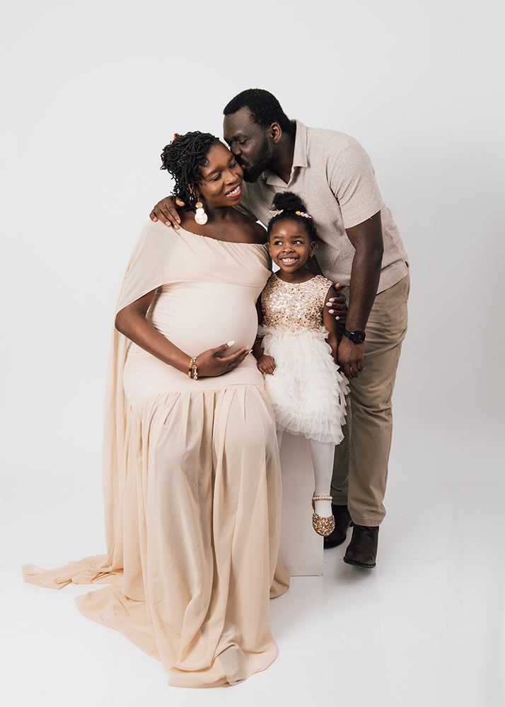Family maternity photography Spalding - pregnant woman with partner and child during studio session near Peterborough