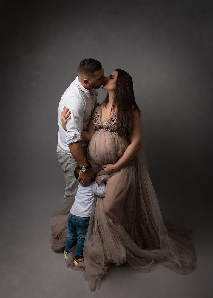 Maternity photography with partner and child Spalding - family maternity session in soft grey tulle gown, Peterborough area