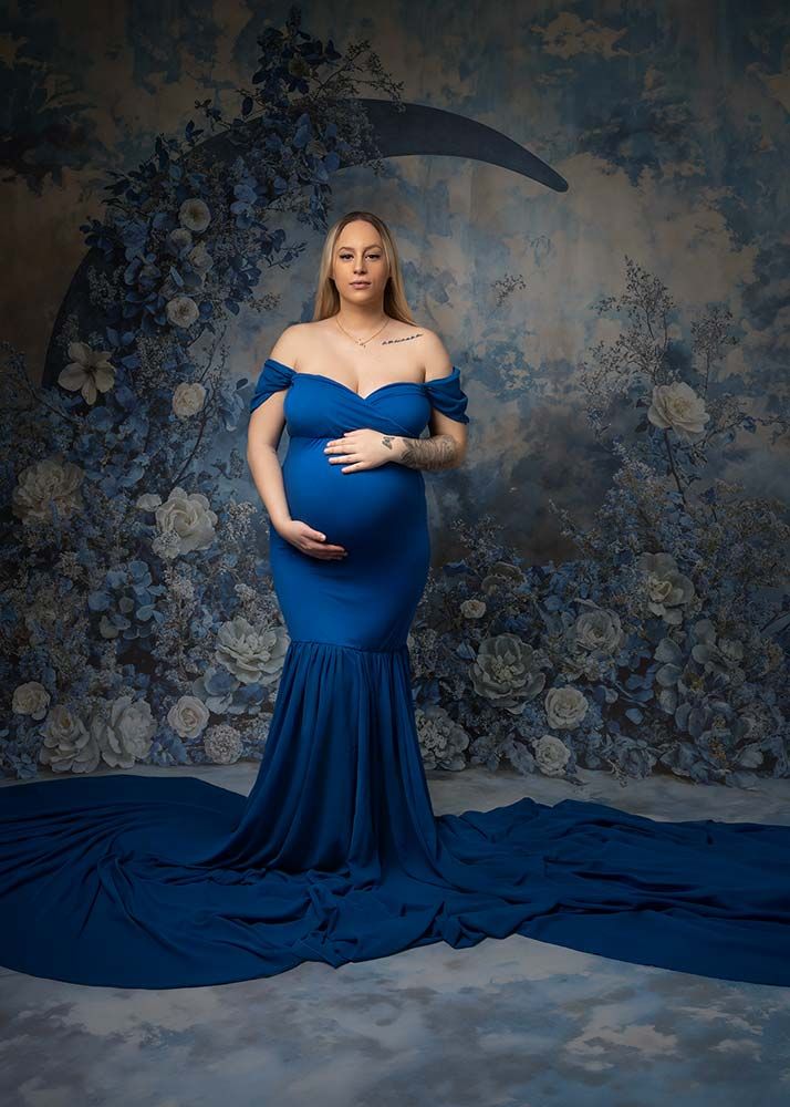 Maternity photographer Spalding - artistic pregnancy portrait with luxury flowing gown in professional studio near Peterborough