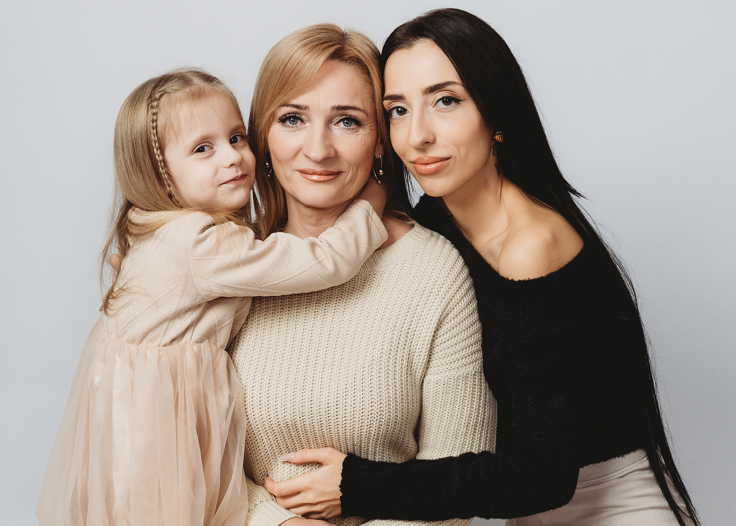 Studio family photography session in Lincolnshire with soft neutral styling.