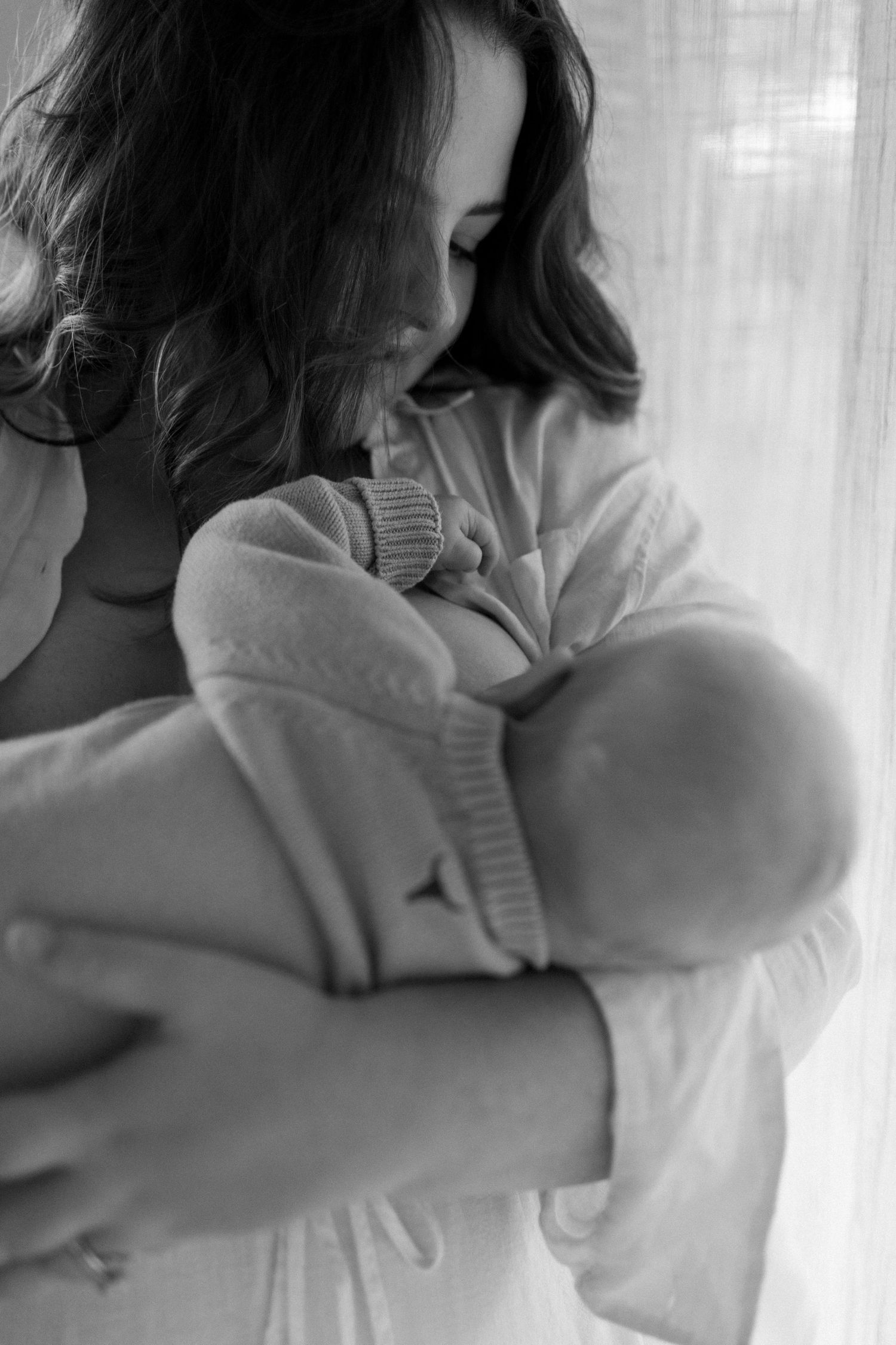 Intimate black and white portrait series showing soft, gentle movements.