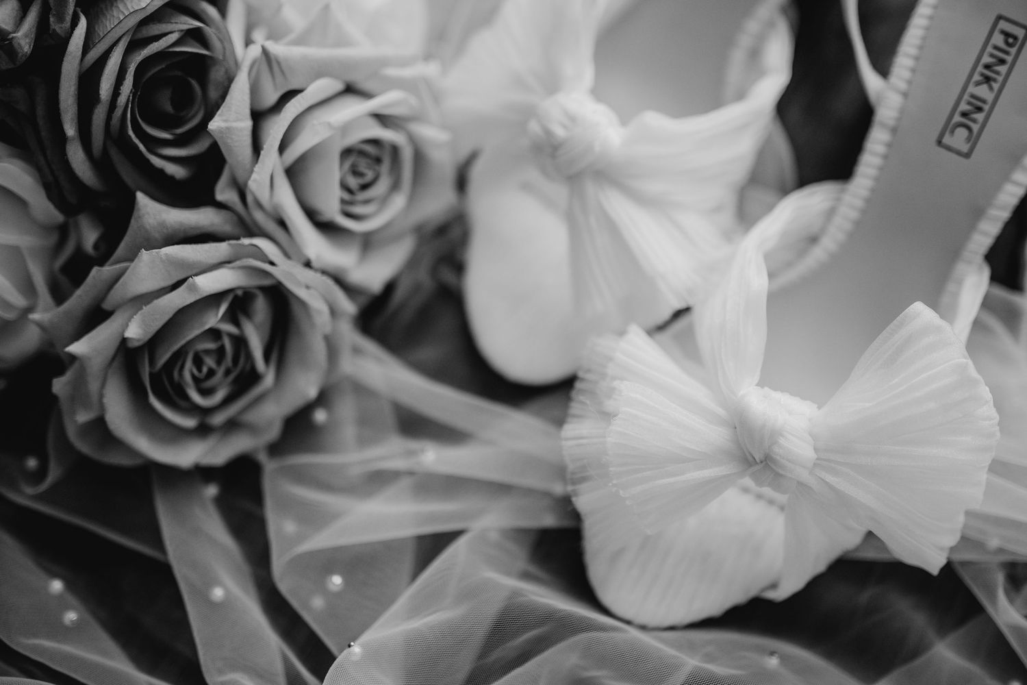 Elegant white roses and floral arrangements in black and white.