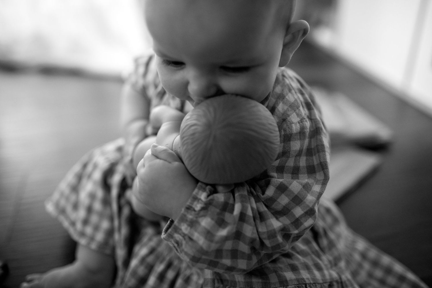 Close-up black and white portrait showing gentle intimate moments.