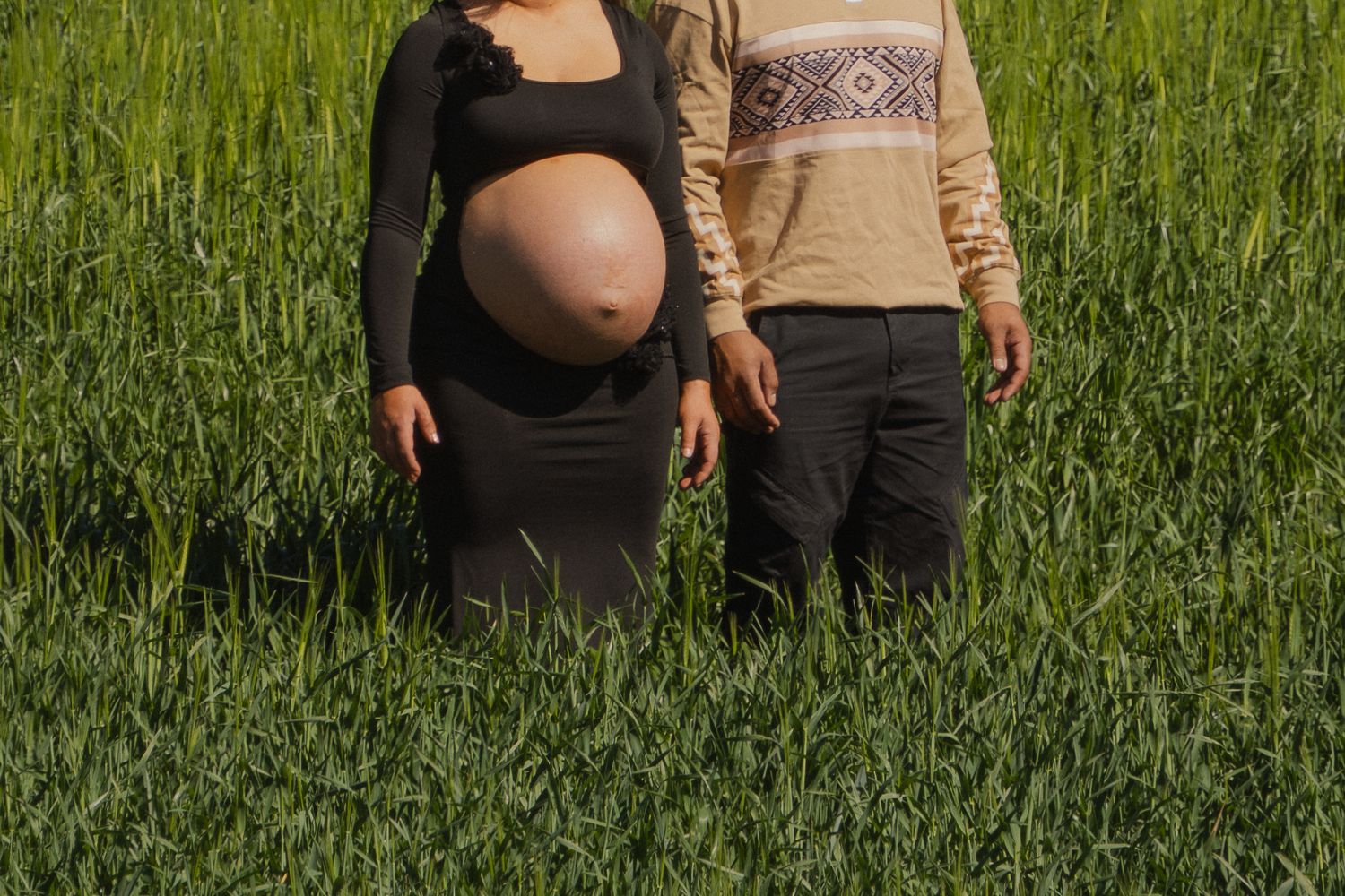 maternity session in grass field