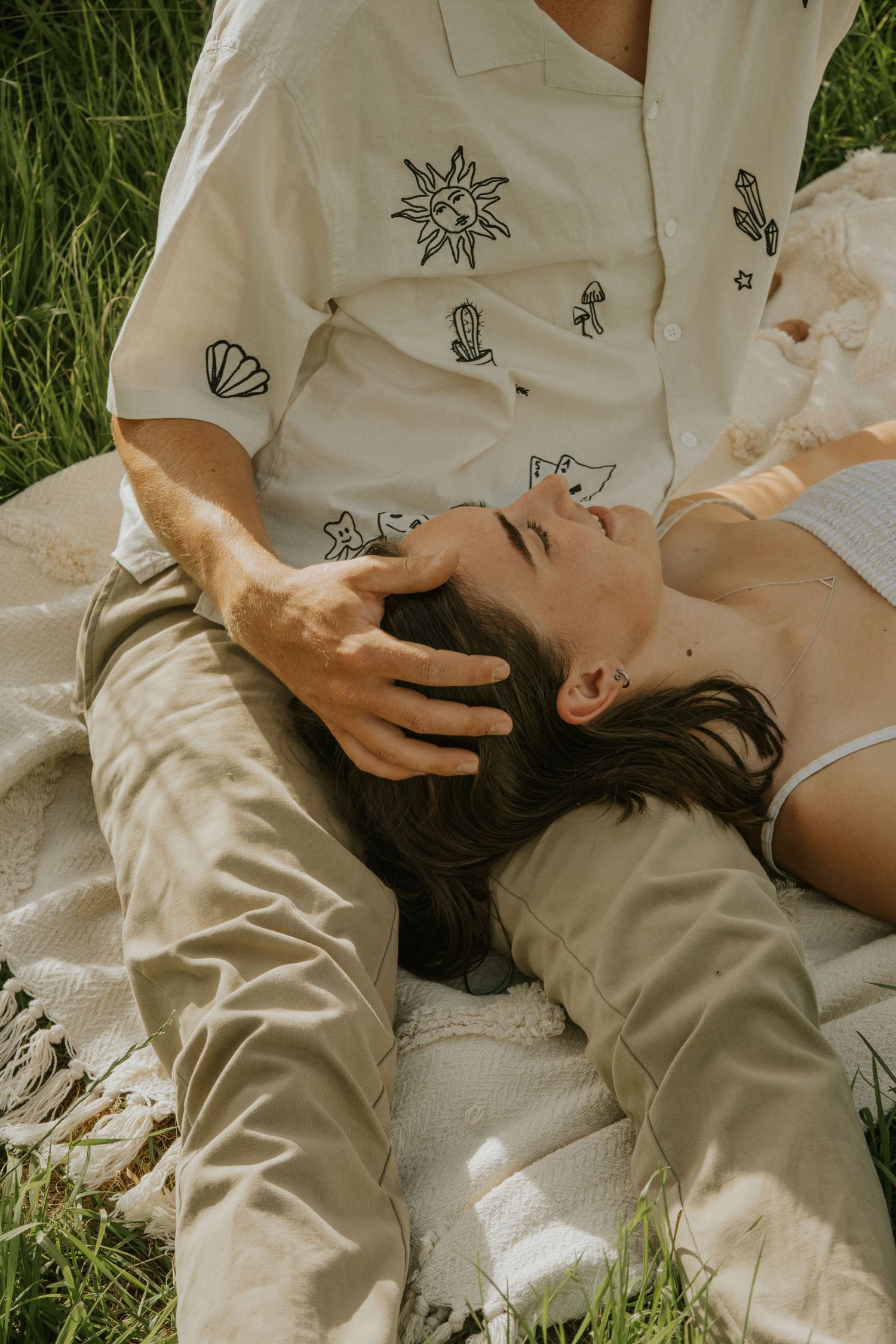couple laying down looking at one another