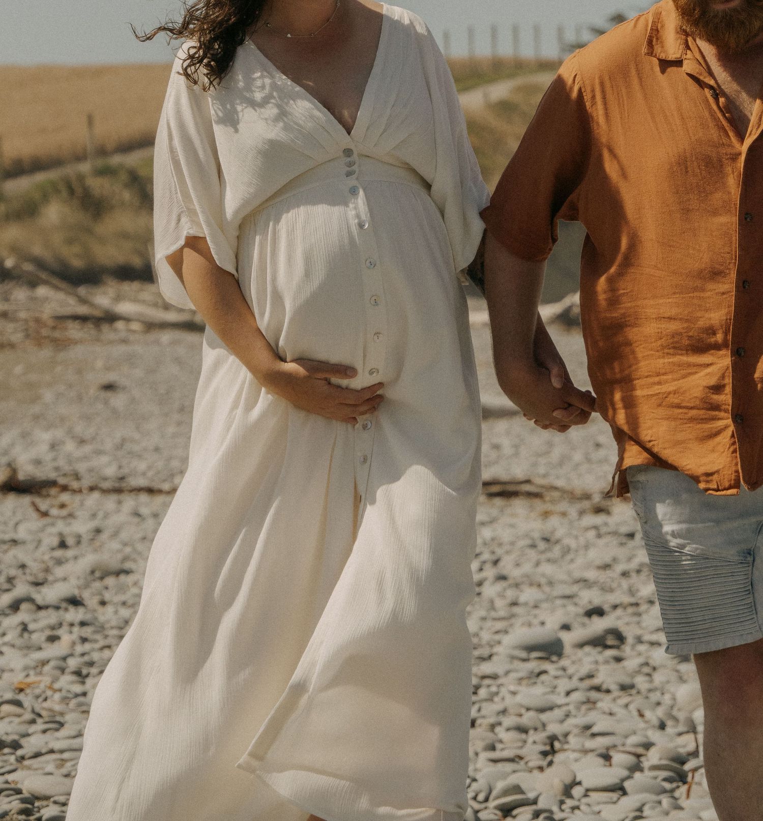 couple holding maternity bump