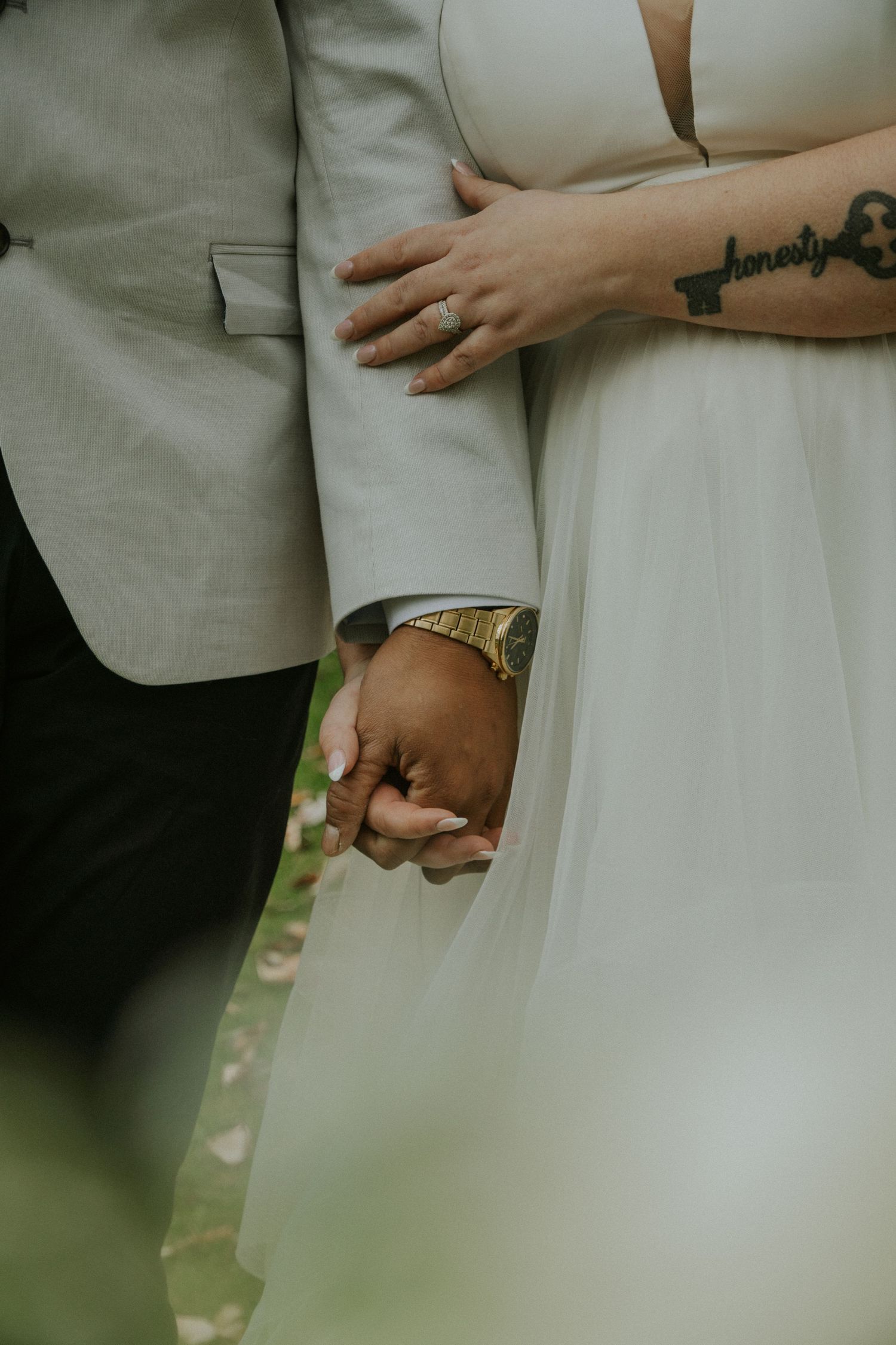 bride and groom holding hands