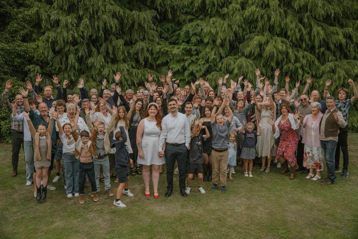 elopement weekend photo, large group of people cheering on couple
