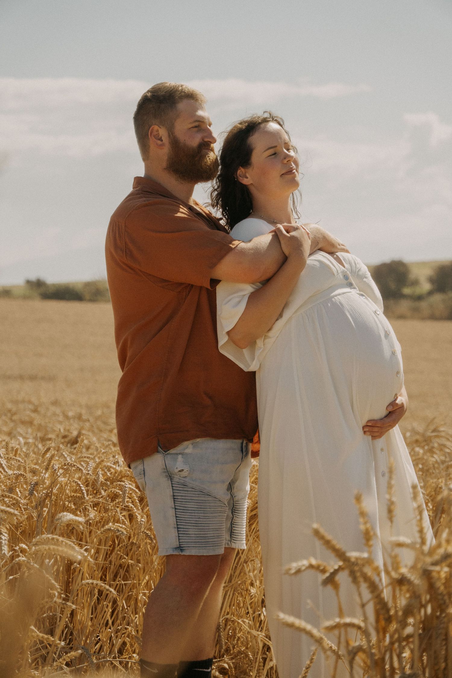 couple holding maternity bump