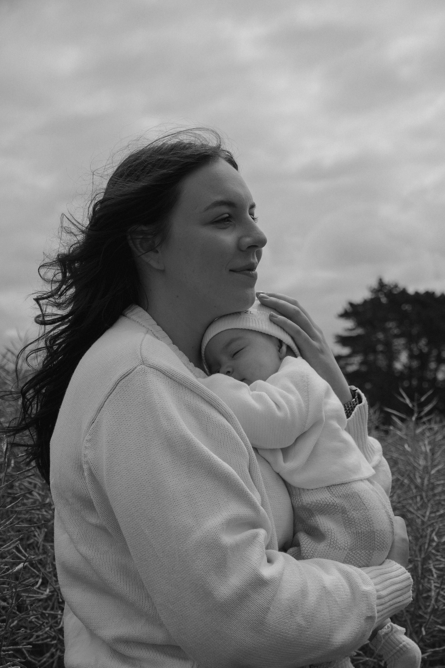 mother holding baby, editorial look
