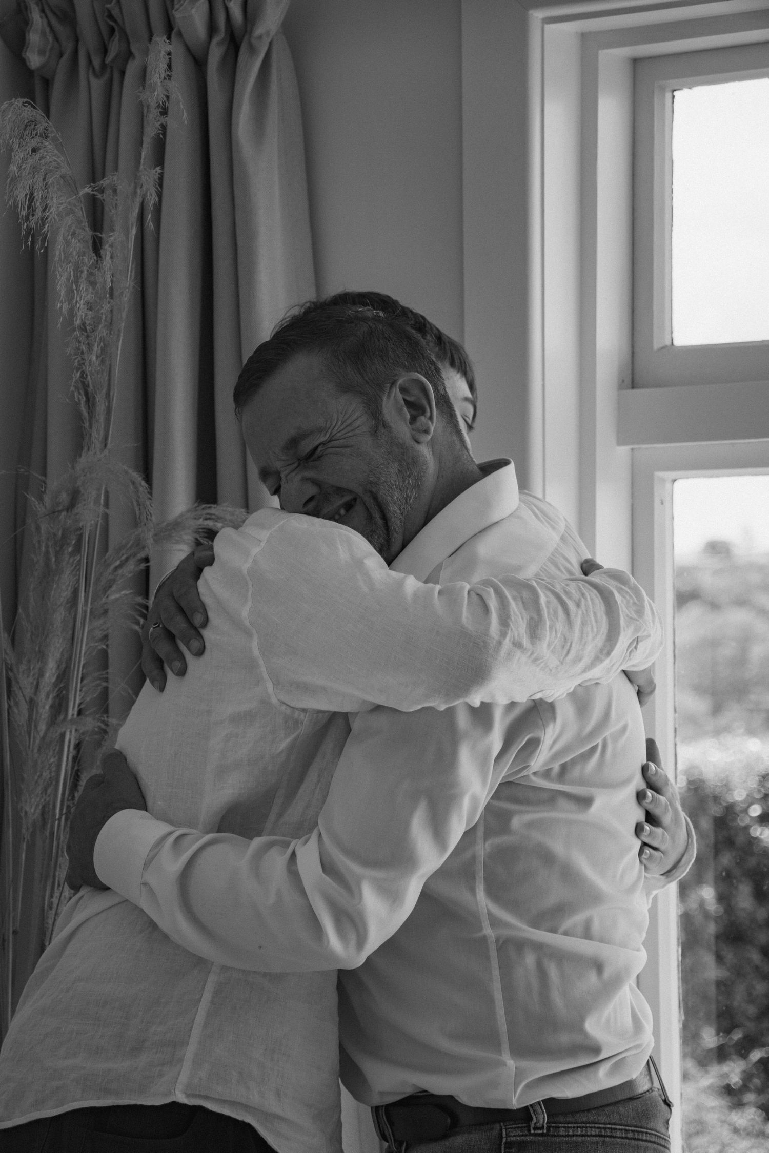 father and son hugging