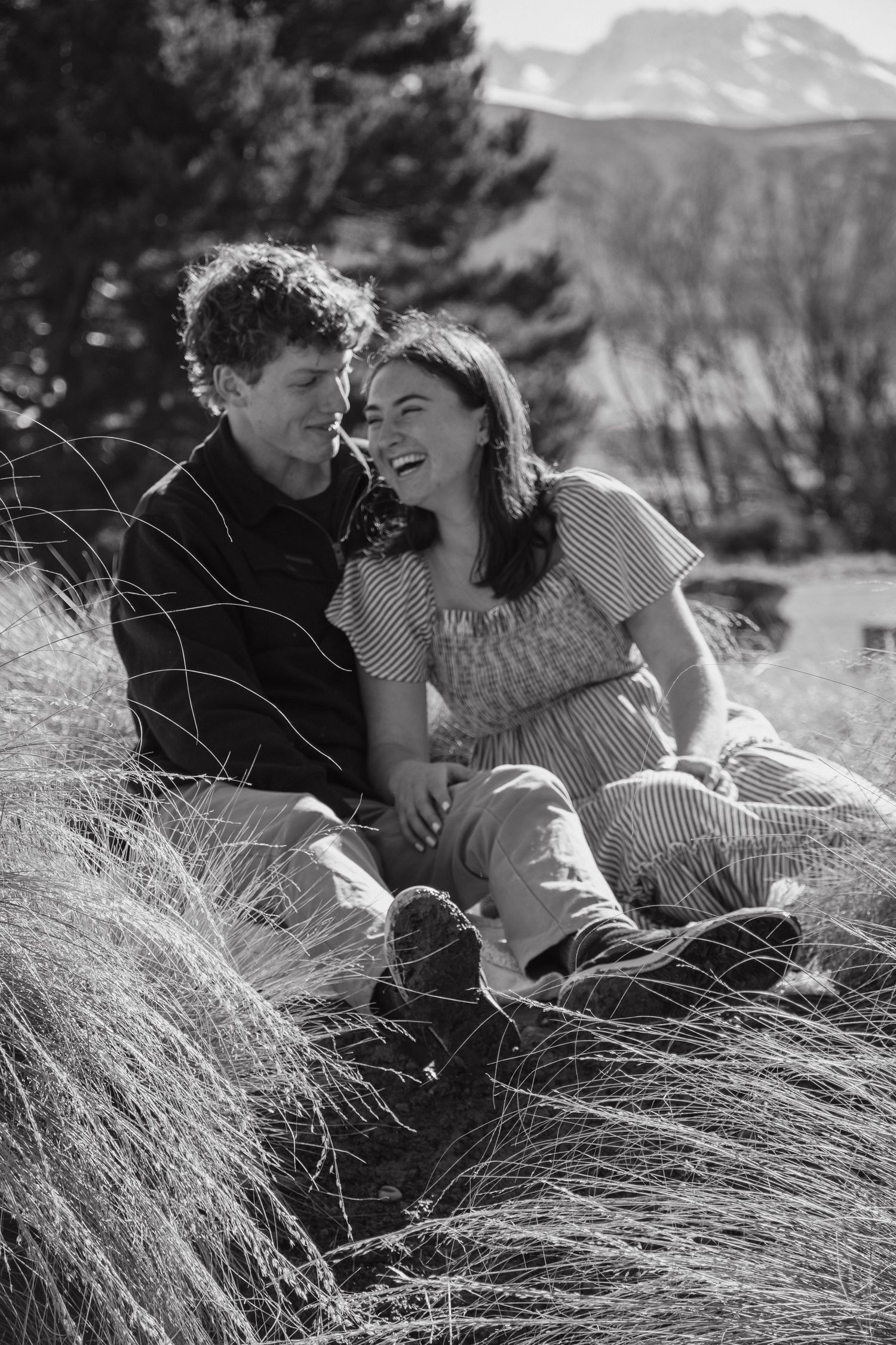 couple laughing sitting down