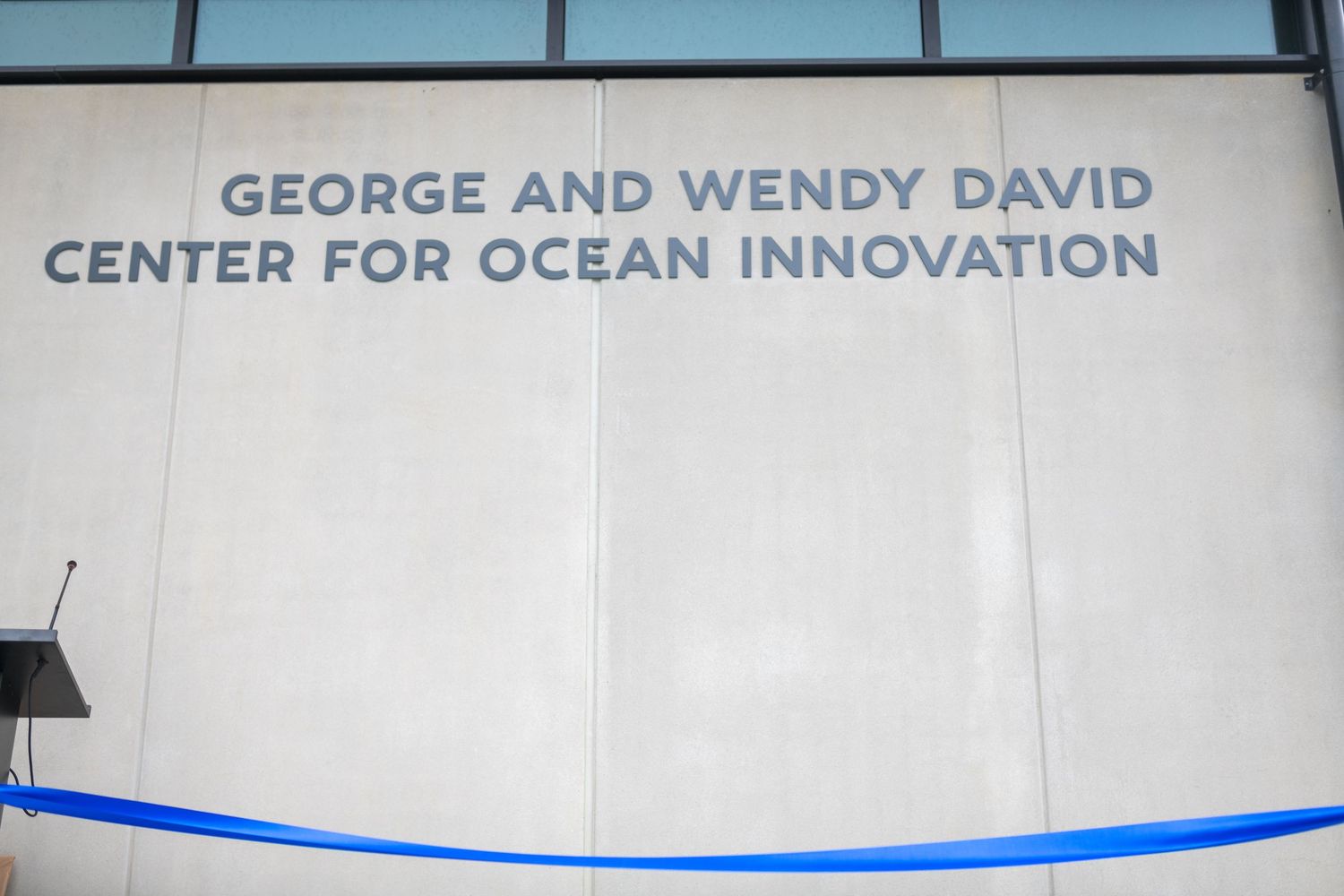 Sign for George and Wendy David Center for Ocean Innovation mounted on building wall.