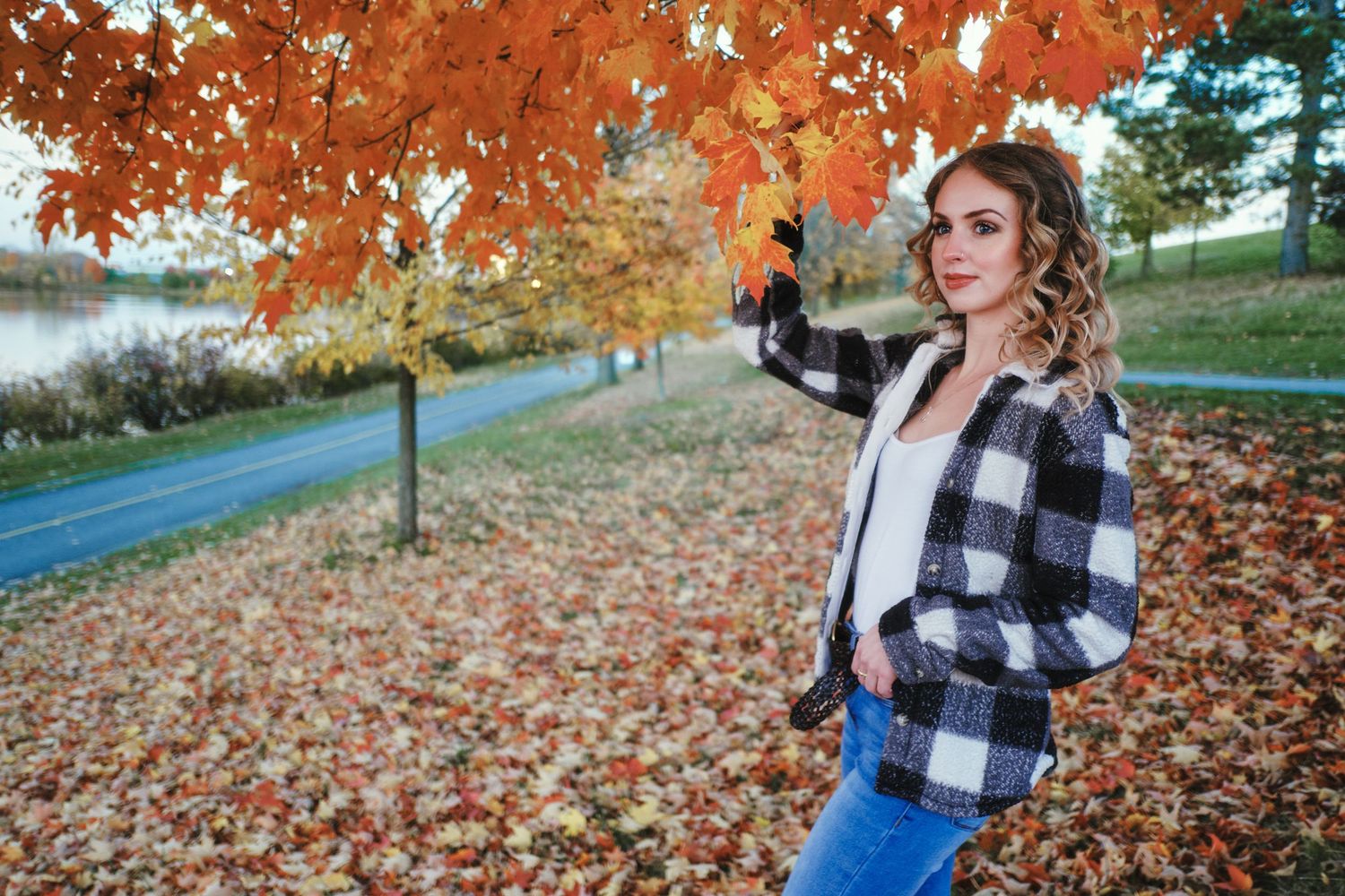 Woman in fall leaves