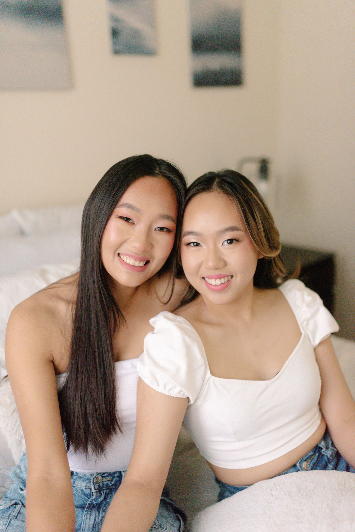 Lifestyle portrait session in bright modern bedroom setting.