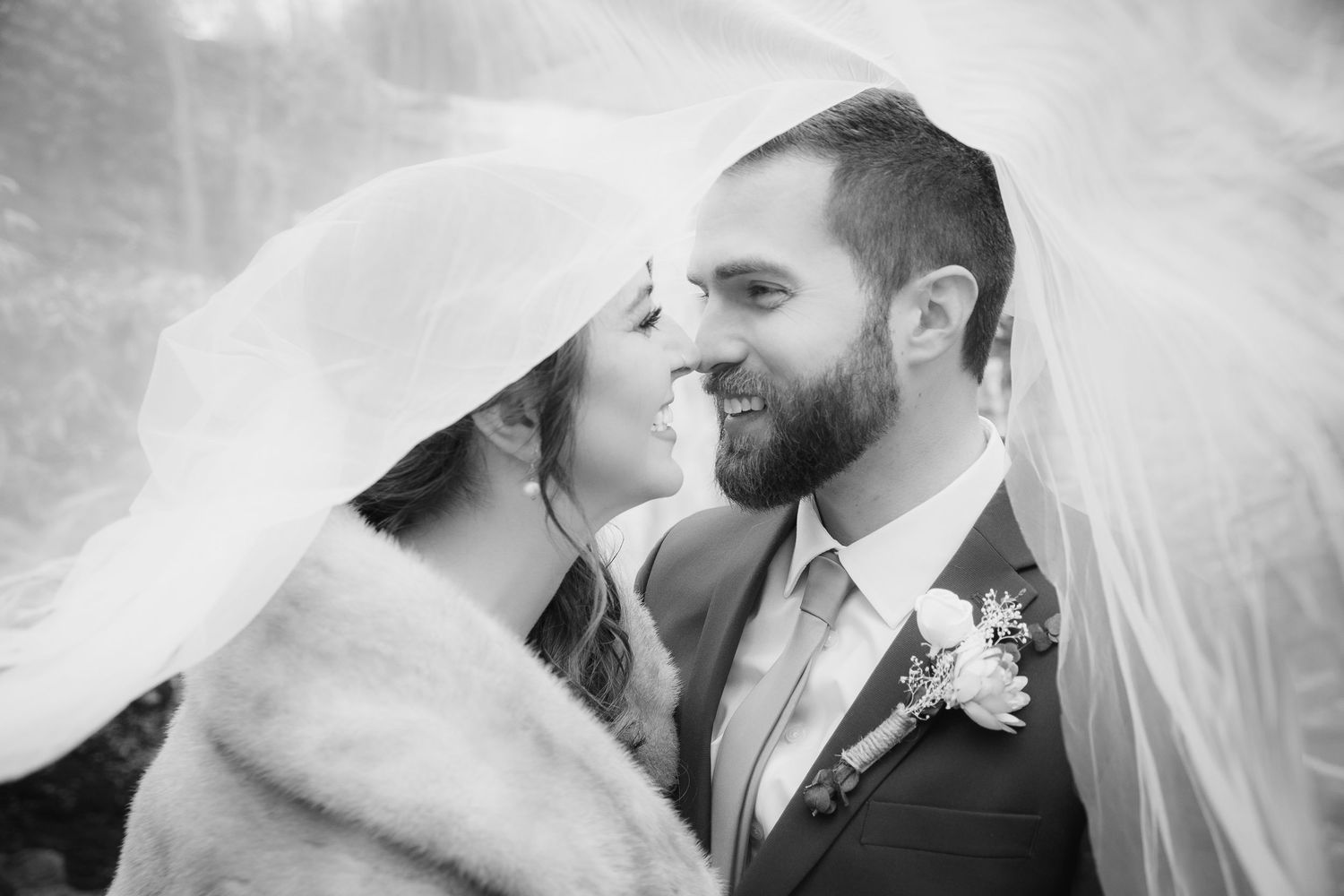 Black and white intimate wedding portraits showing tender moments between newlyweds.