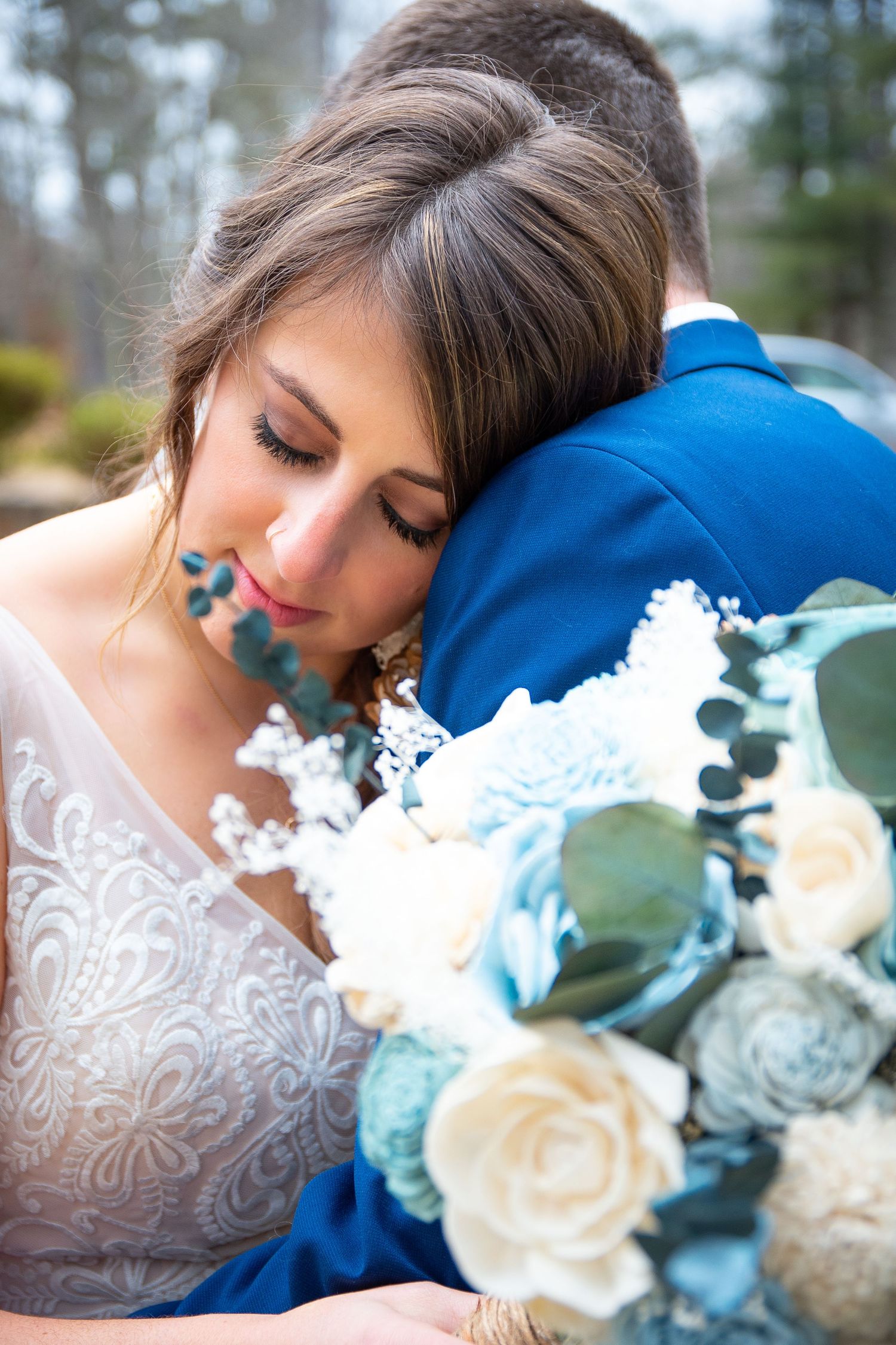 Romantic wedding photos with white roses and delicate lace details.