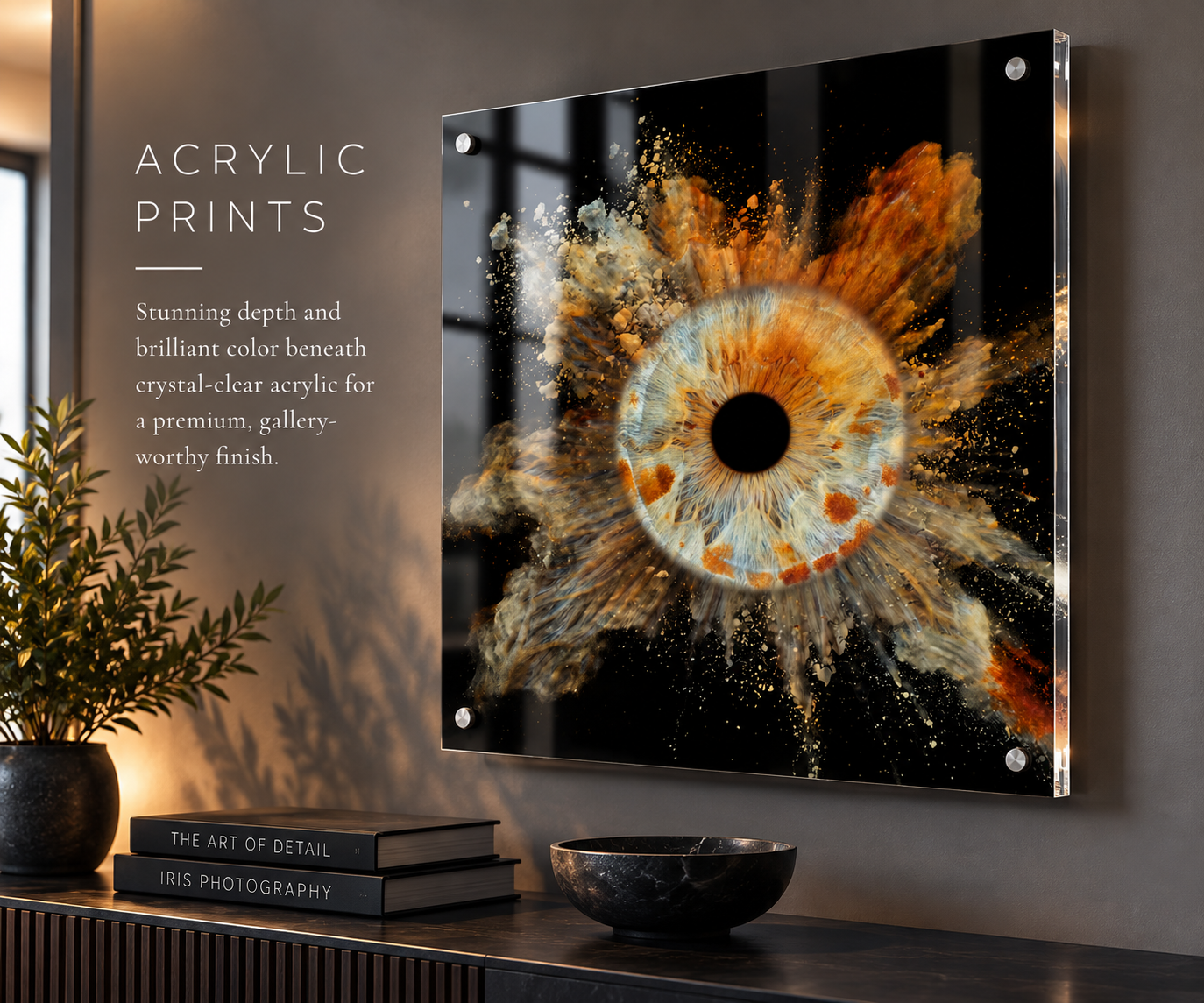 Acrylic print wall art featuring a vibrant eye with explosive golden particles, mounted on a dark wall above a styled shelf.