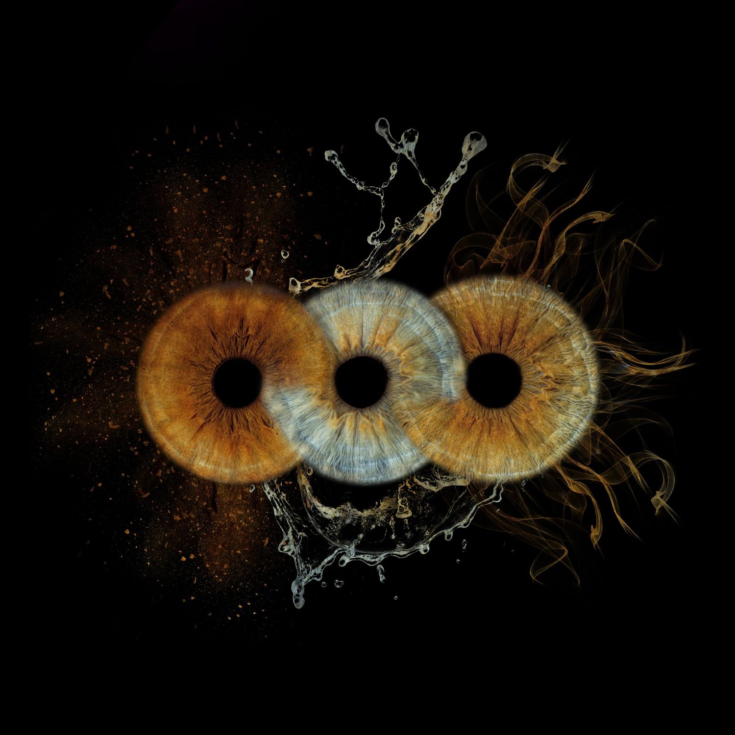 Three macro iris eyes with water splash and golden dust on black background, artistic eye photography.