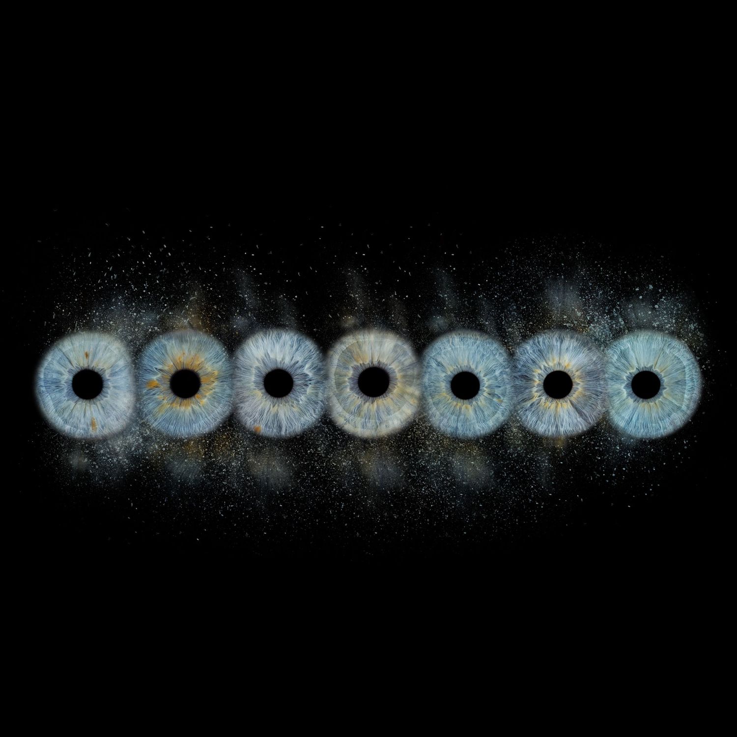 Seven blue human eyes with golden irises arranged in a row against a dark black background with sparkling particles.