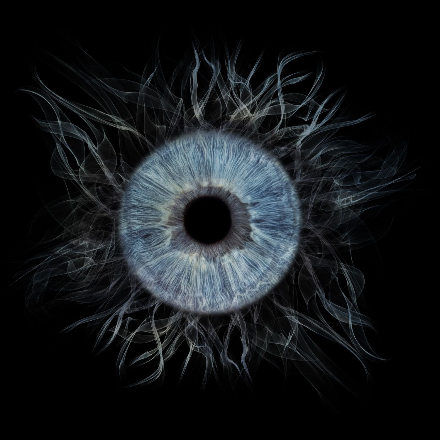A blue human iris with wispy dark tendrils radiating outward on a black background.