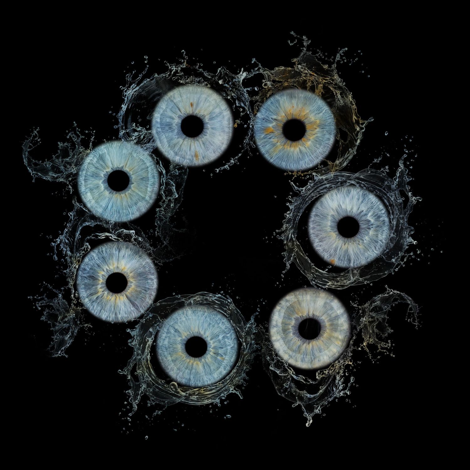 Six blue human eyes arranged in a circle with water splashes on a black background.
