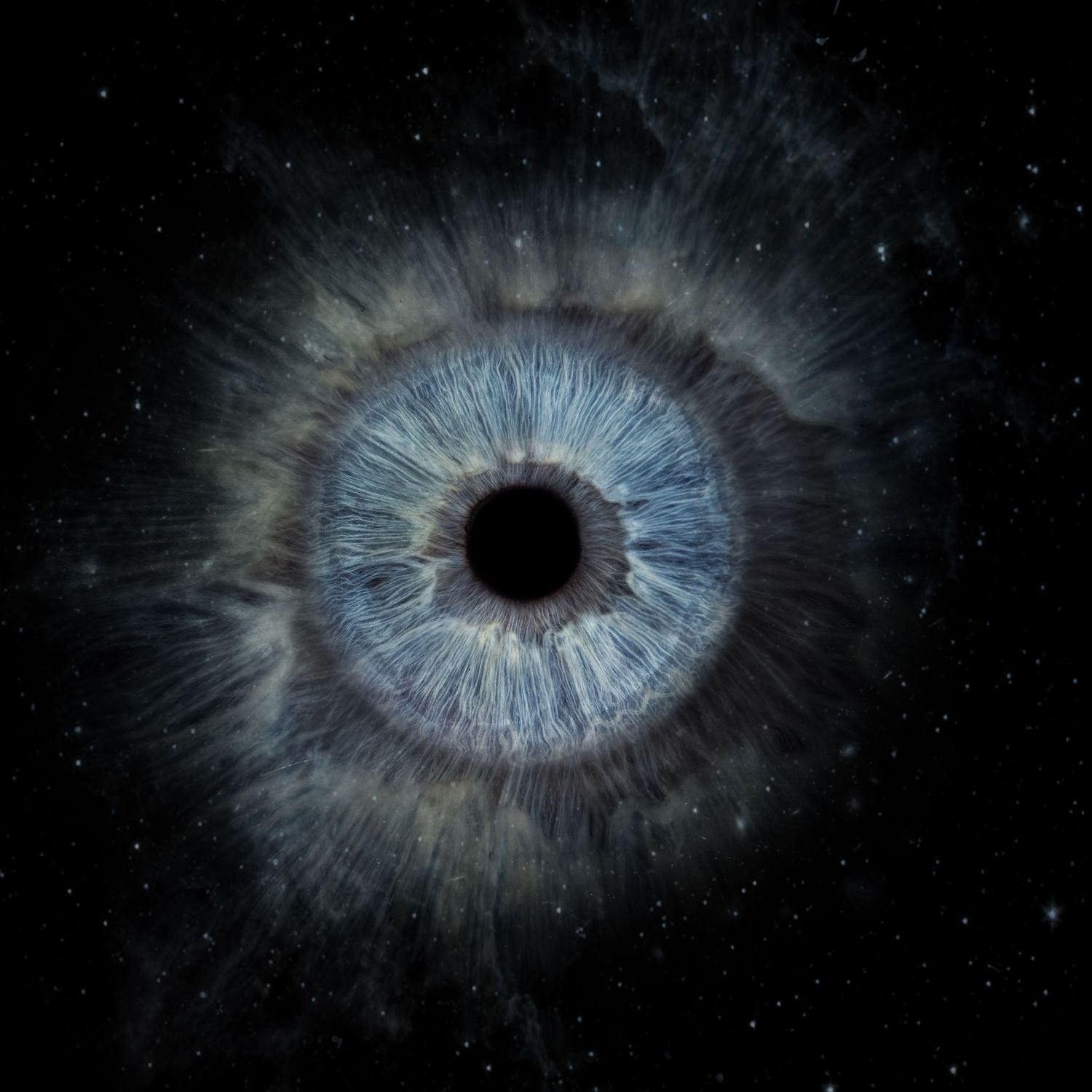 Dramatic blue human eye iris resembling a cosmic nebula against a starry space background.