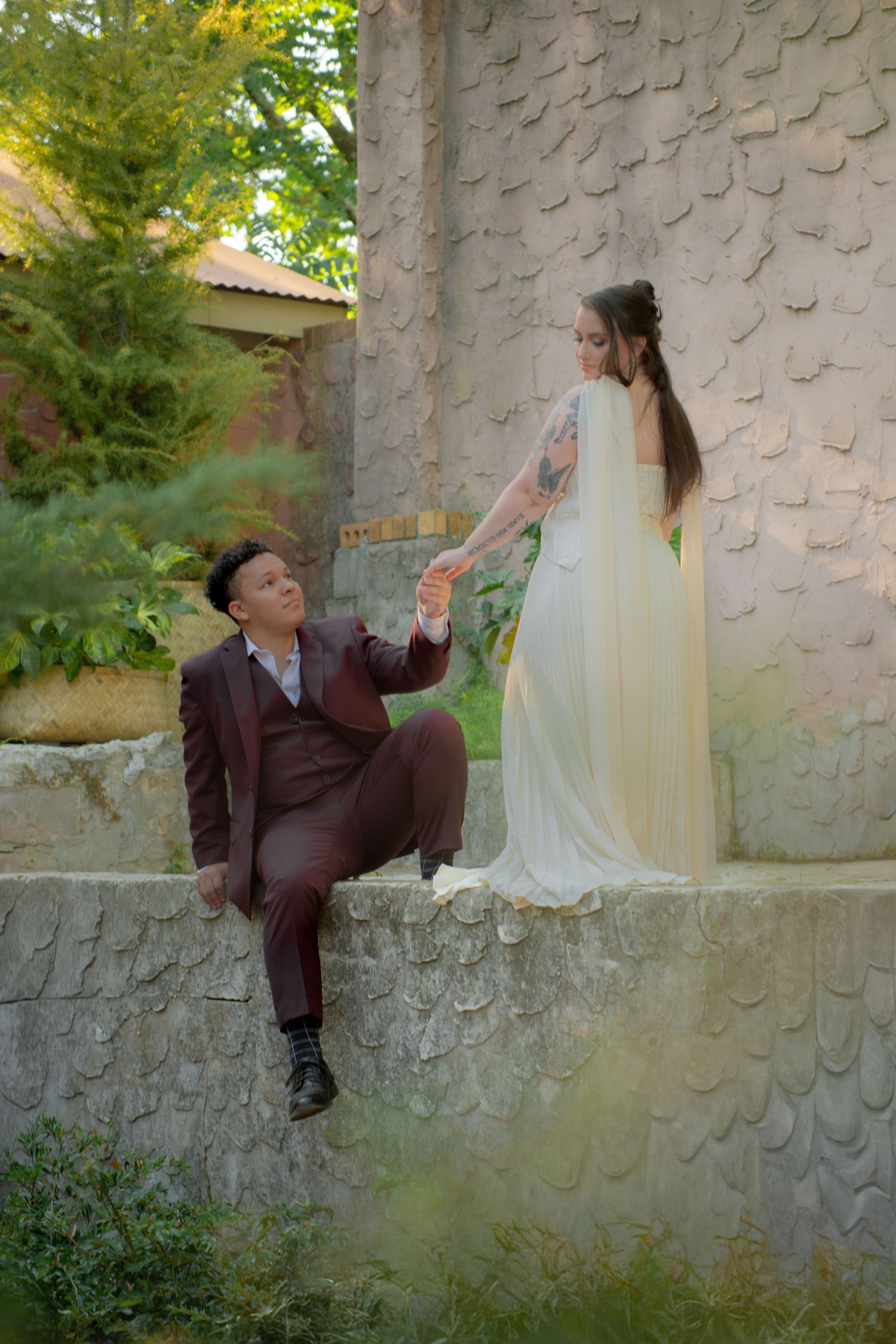 A man and woman holding each other during engagement photos