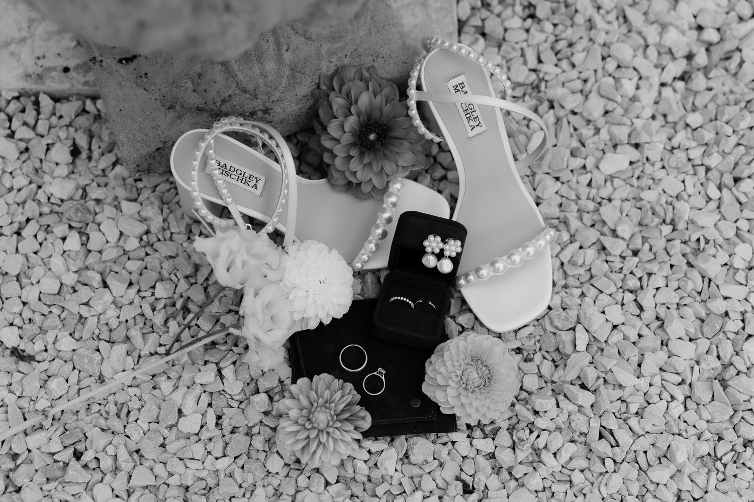 Black and white photo montage showing various close-up shots of jewelry and accessories on a textured surface.