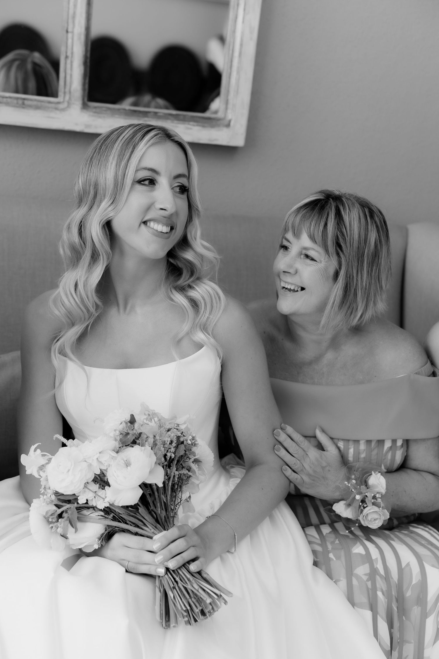 A series of black and white wedding photos showing bridesmaids in white dresses holding bouquets and sharing joyful moments.
