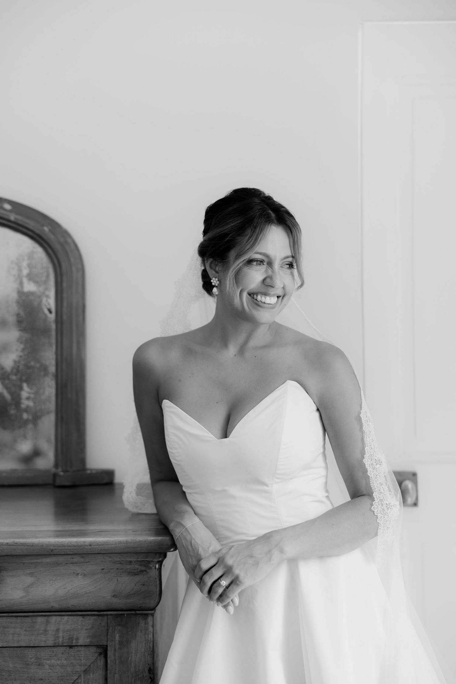 Classic white strapless wedding gown captured in elegant bridal portraits.