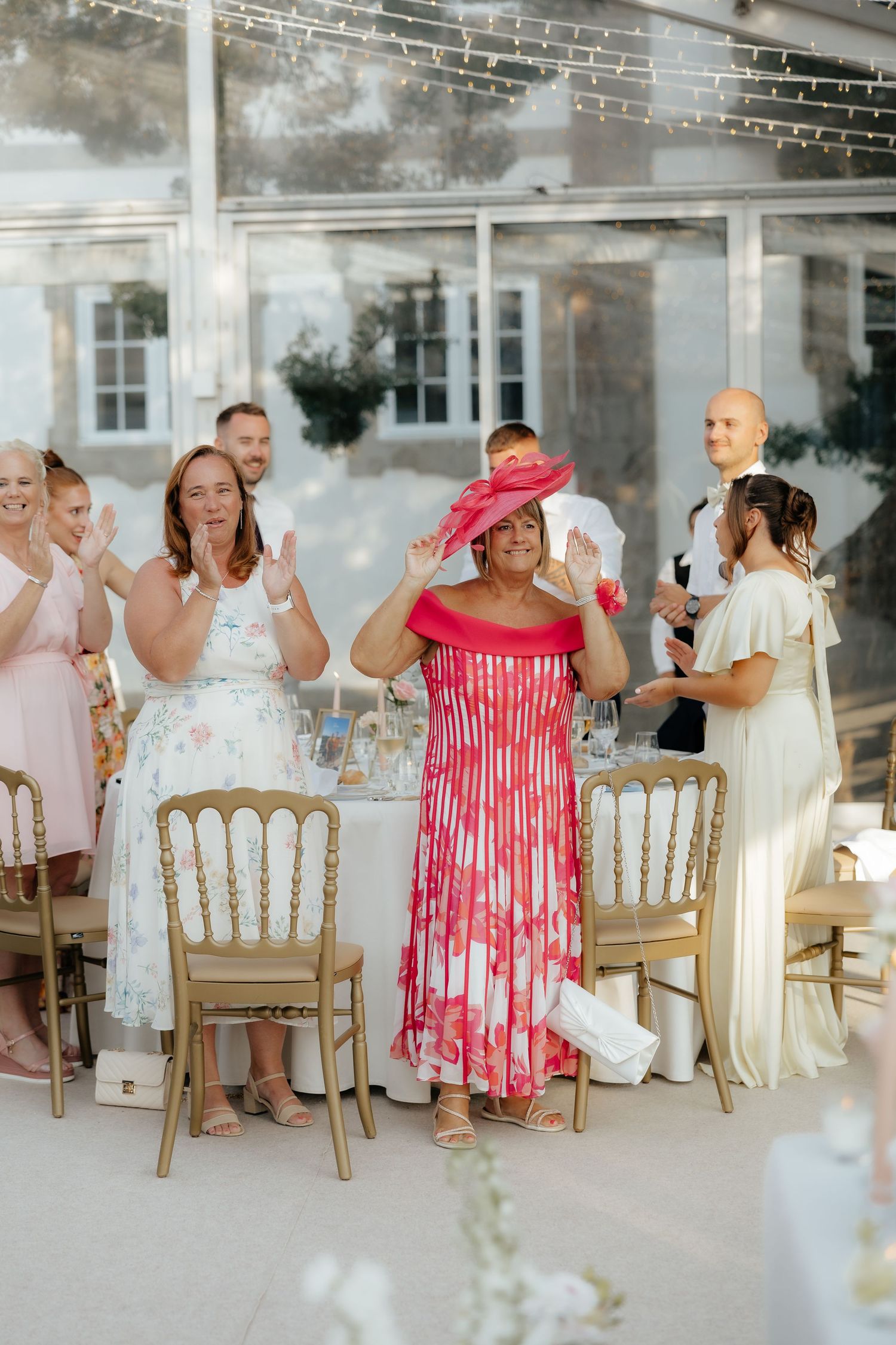 A sequence of wedding reception photos showing guests seated in gold chairs enjoying a celebration in a bright indoor venue.