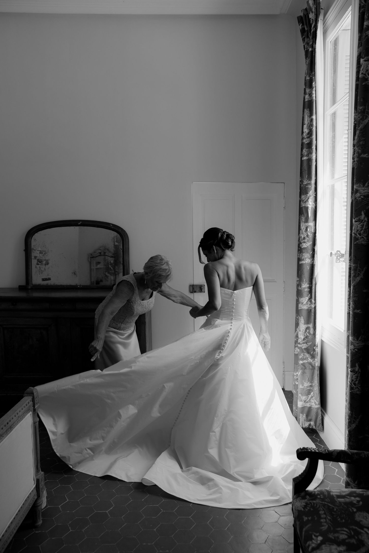 Sequential photos showing flowing white fabric movement in an indoor space with natural light.