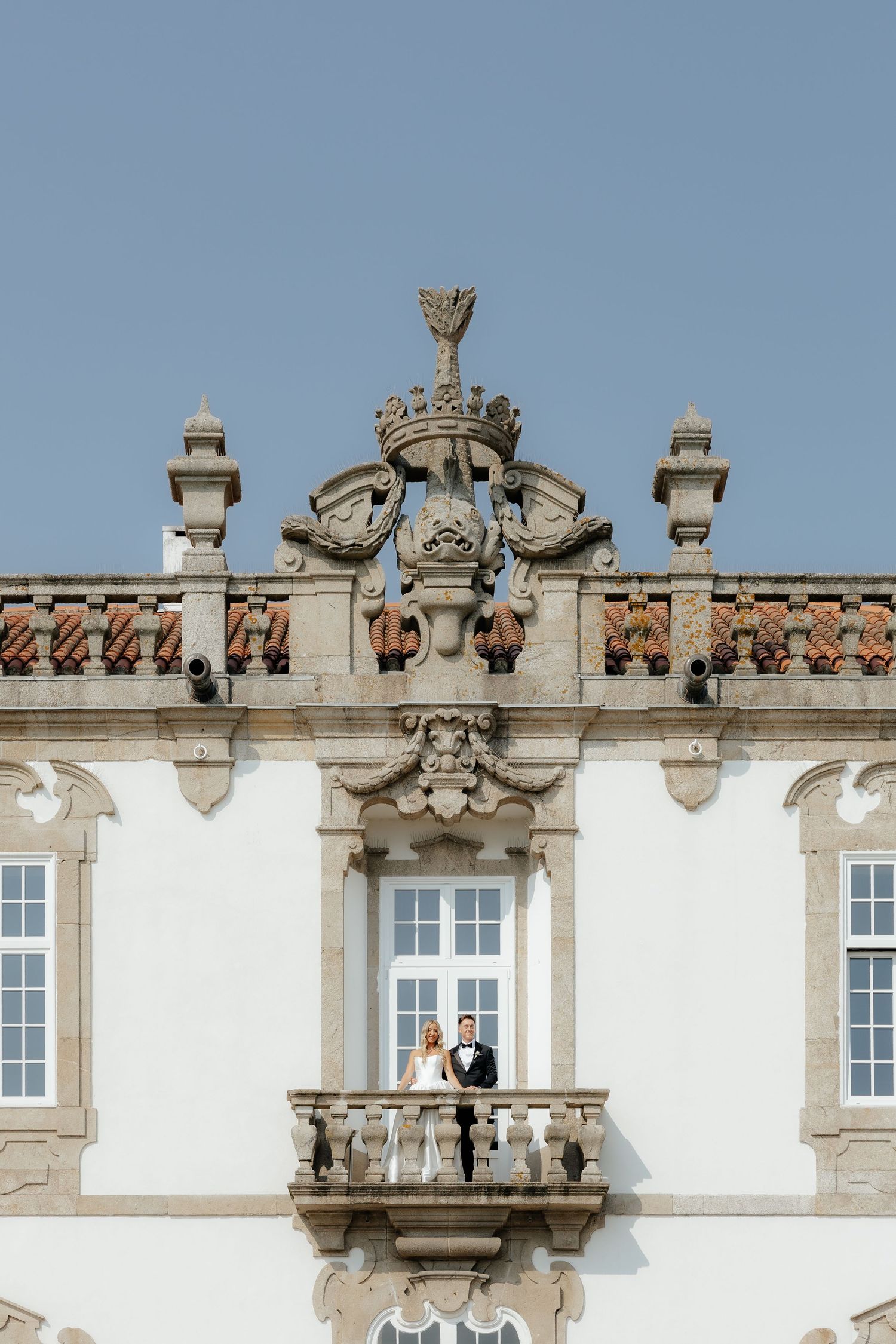Ornate architectural details of a white stone building facade with decorative carvings and windows.