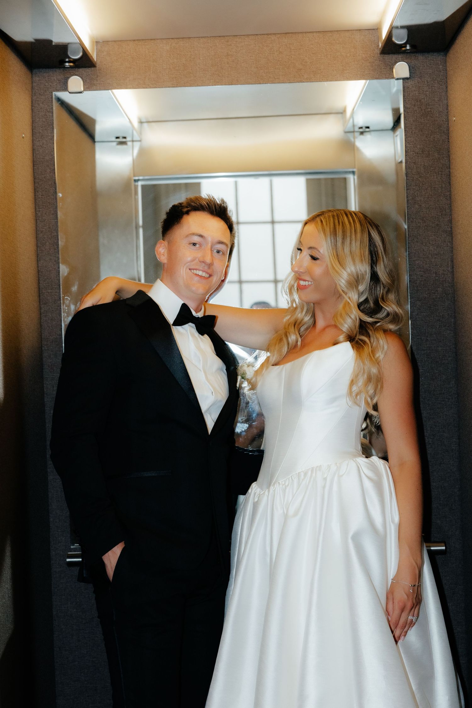 A bride and groom share a joyful moment together in a series of candid wedding photos.