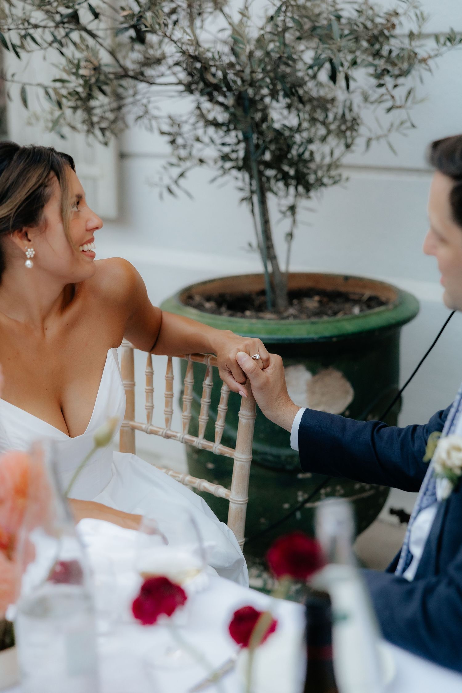 Wedding guests enjoying an intimate outdoor celebration with elegant table settings and natural decor.