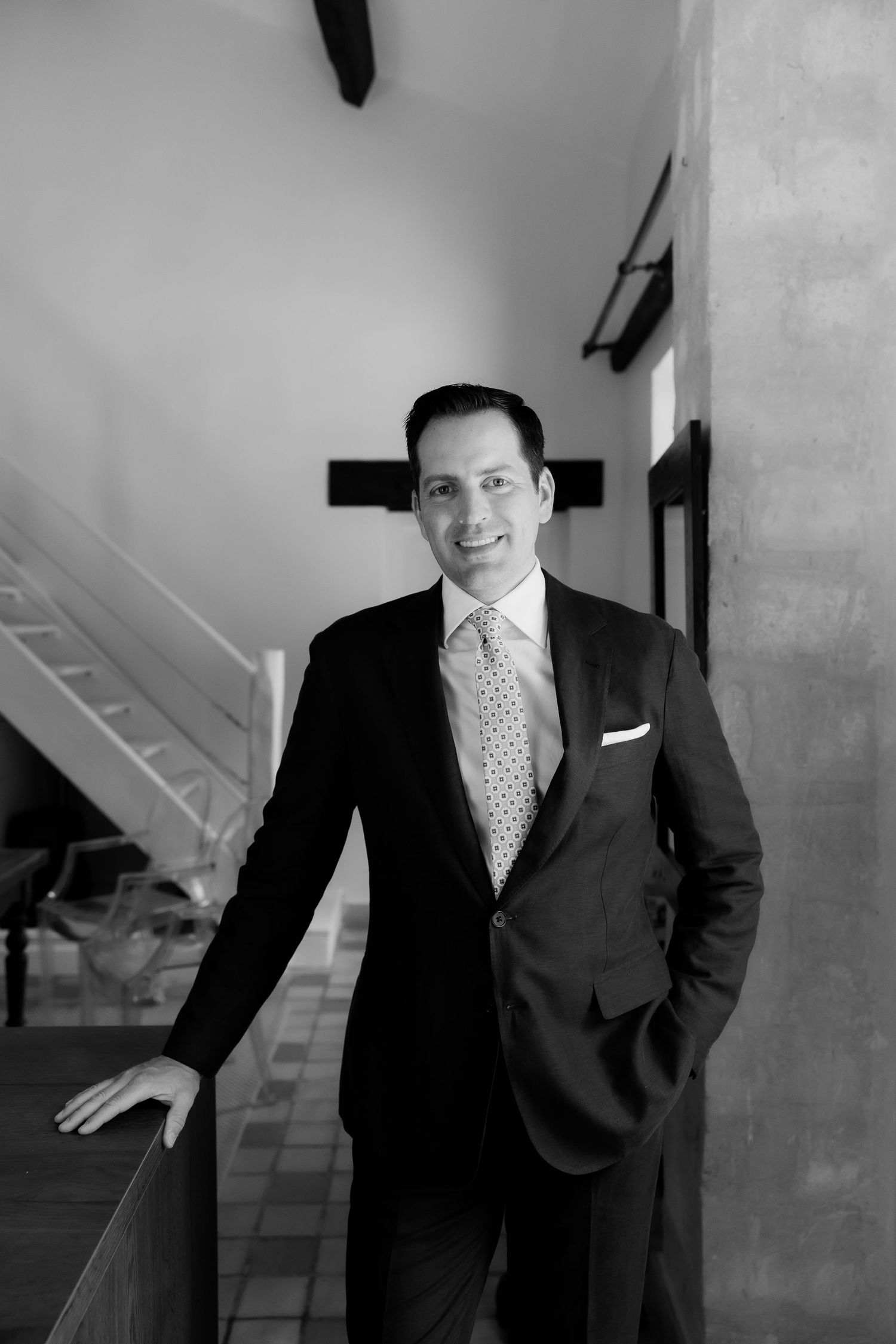 Professional portrait sequence showing different poses in a business setting.