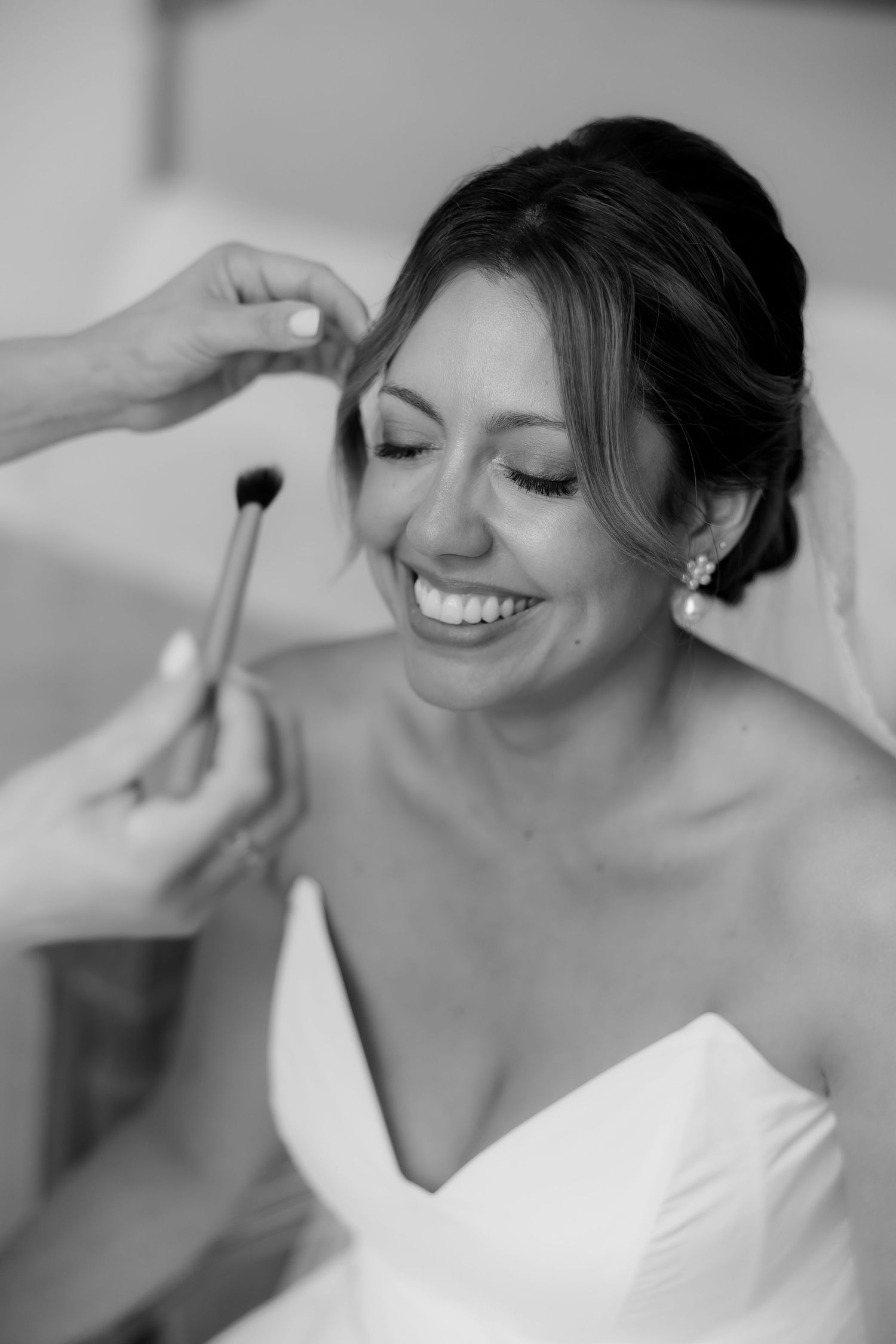 Candid black and white sequence of joyful moments in a white wedding dress.