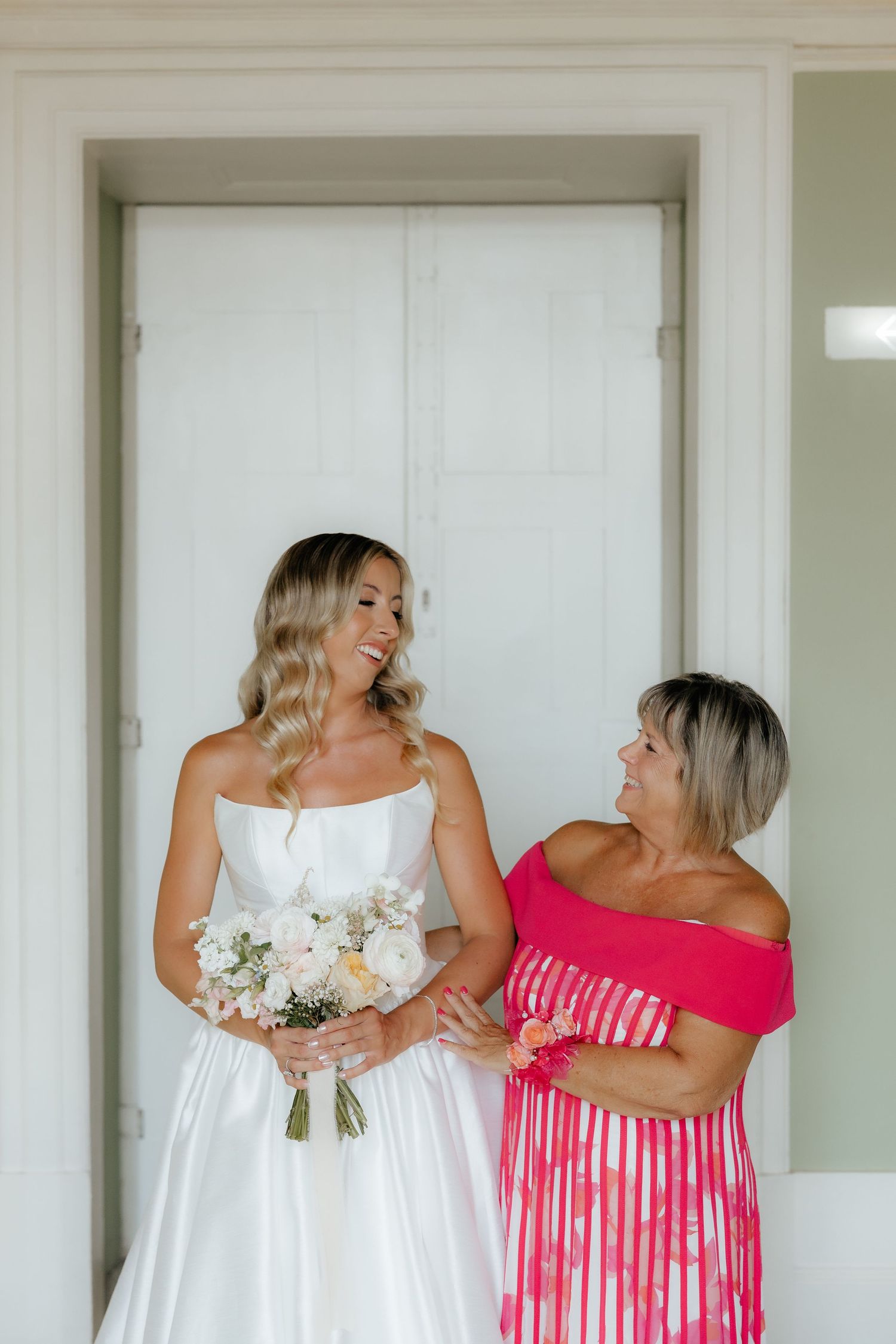A series of photos showing bridesmaids in pink striped dresses and a bride in white preparing for a wedding.