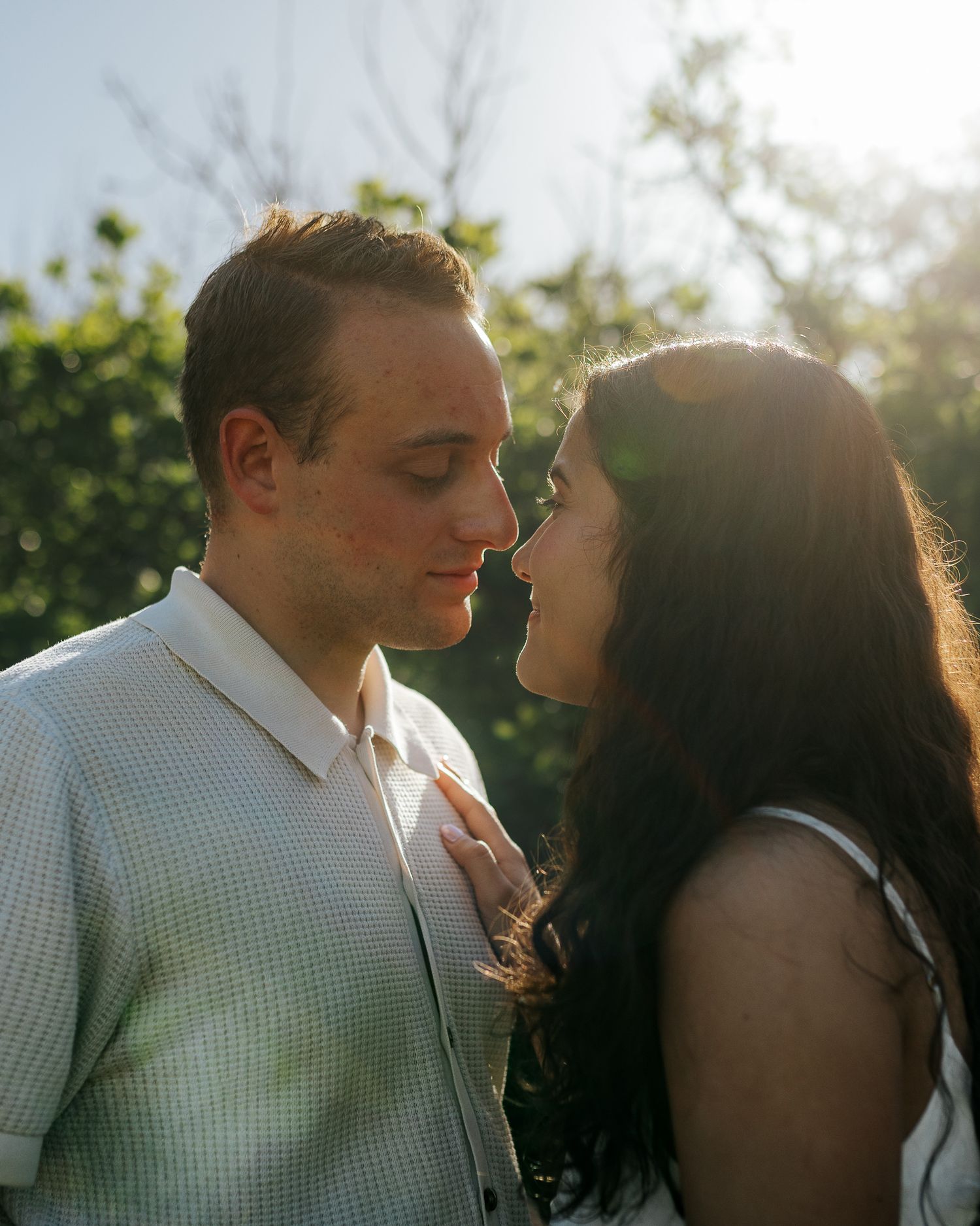 Couple posing, looking into each other's eyes during sunrise golden hour at South Valley Park