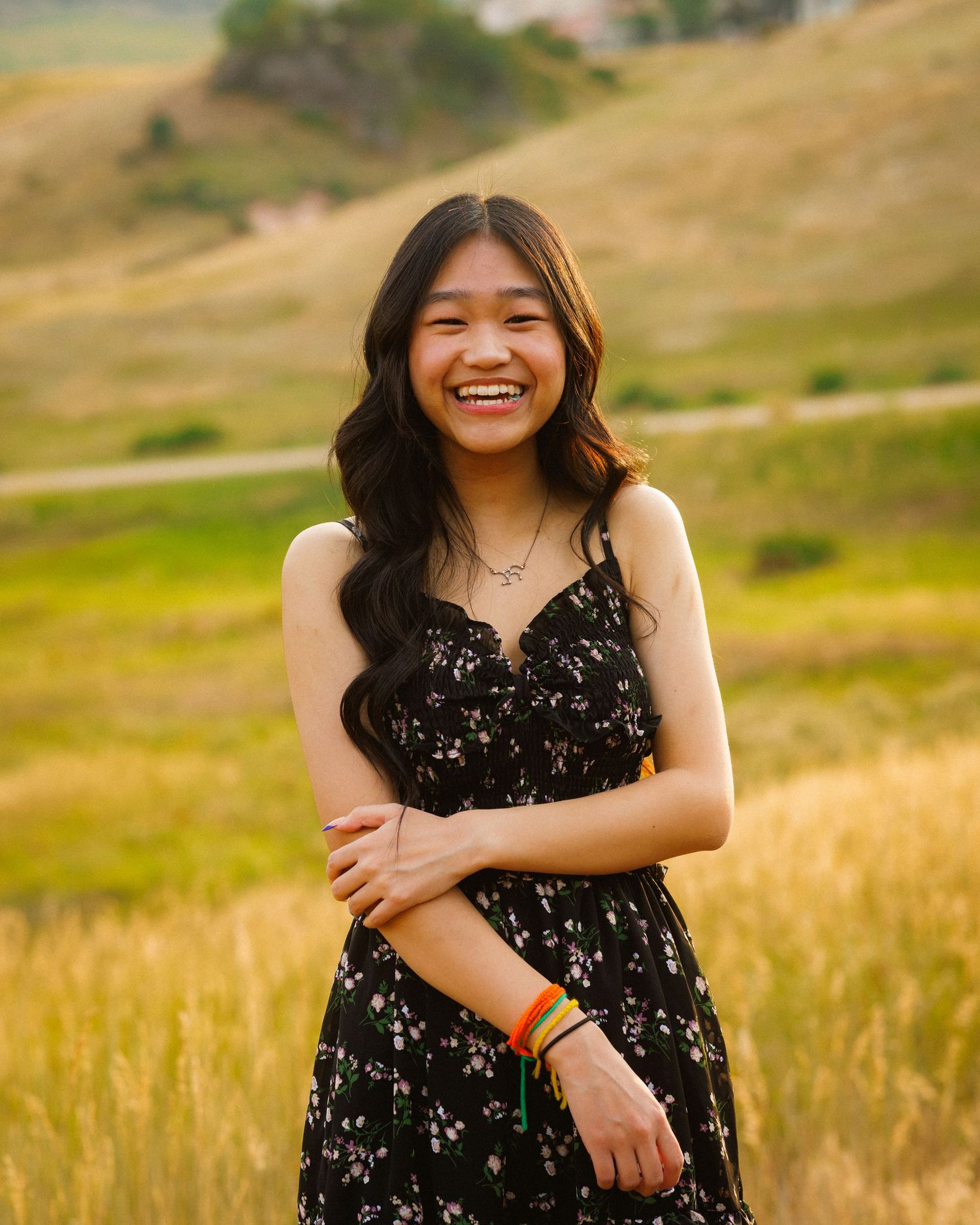 Senior portrait posed with open field in the background at South Valley Park