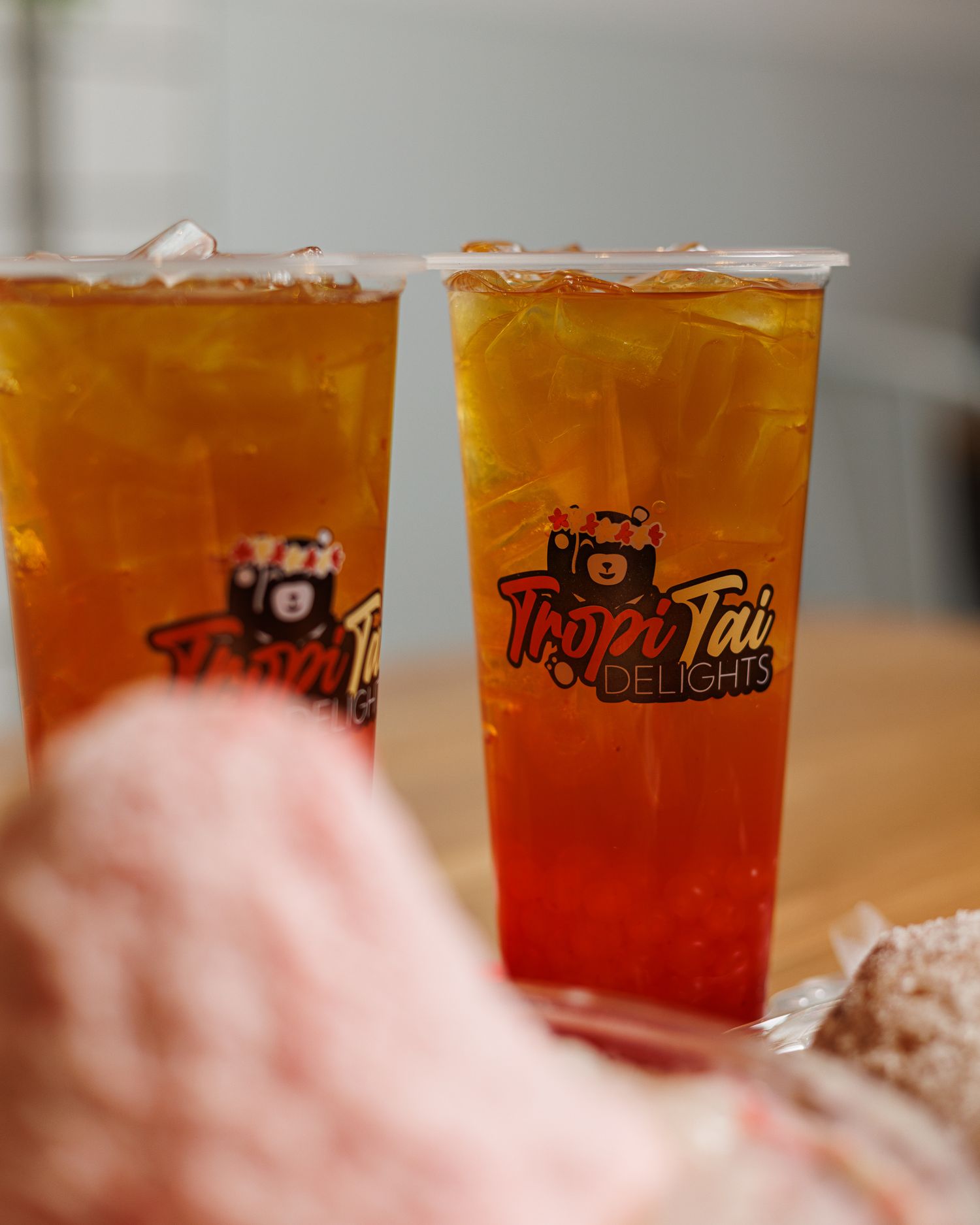 2 cold, strawberry dragondruit teas, with strawberry popping boba from TropiTai Delights